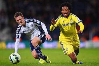 WEST BROMWICH, ENGLAND - MAY 18:  Craig Gardner of West Bromwich Albion and Juan Cuadrado of Chelsea stumble as they battle for the ball during the Barclays Premier League match between West Bromwich Albion and Chelsea at The Hawthorns on May 18, 2015 in 