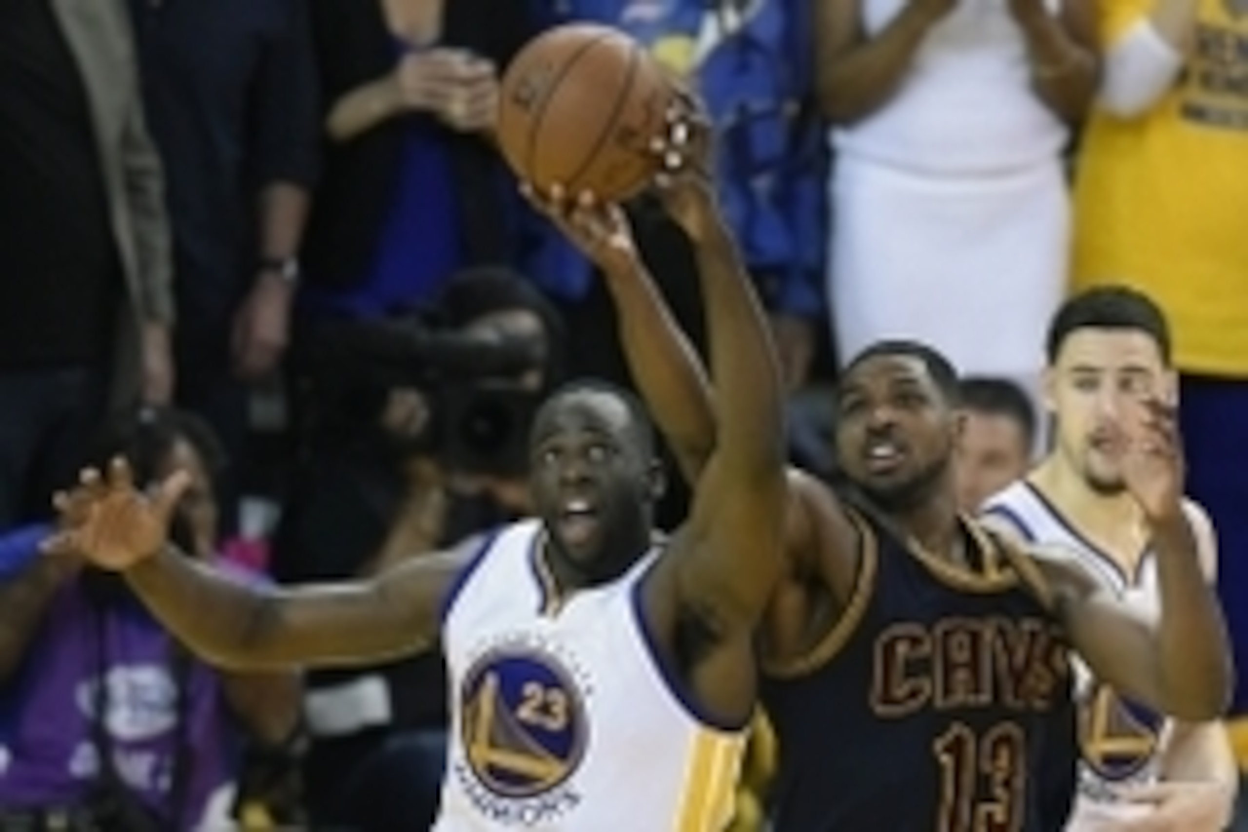 June 7, 2015; Oakland, CA, USA; Golden State Warriors forward Draymond Green (23) plays for the ball against Cleveland Cavaliers center Tristan Thompson (13) during the overtime period in game two of the NBA Finals at Oracle Arena. Mandatory Credit: Bob D
