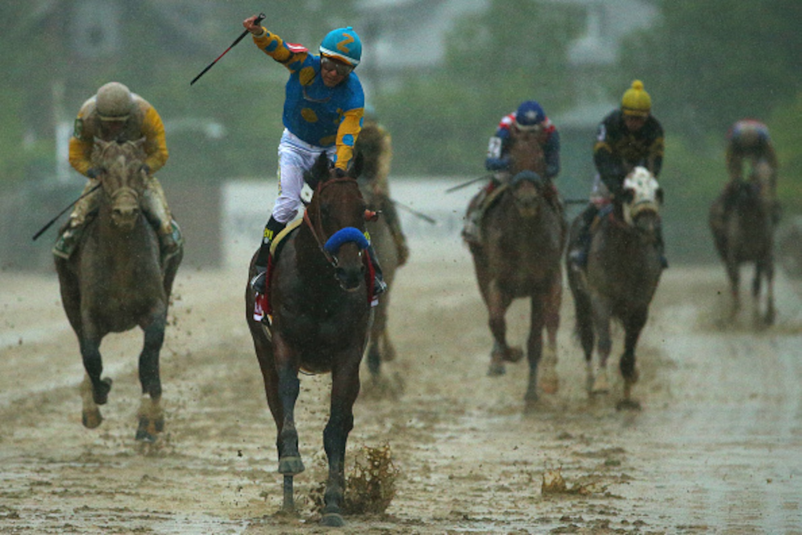 BALTIMORE, MD - MAY 16:  American Pharoah #1 ridden by Victor Espinoza crosses the finish line to win the 140th running of the Preakness Stakes at Pimlico Race Course on May 16, 2015 in Baltimore, Maryland.  (Photo by Patrick Smith/Getty Images)