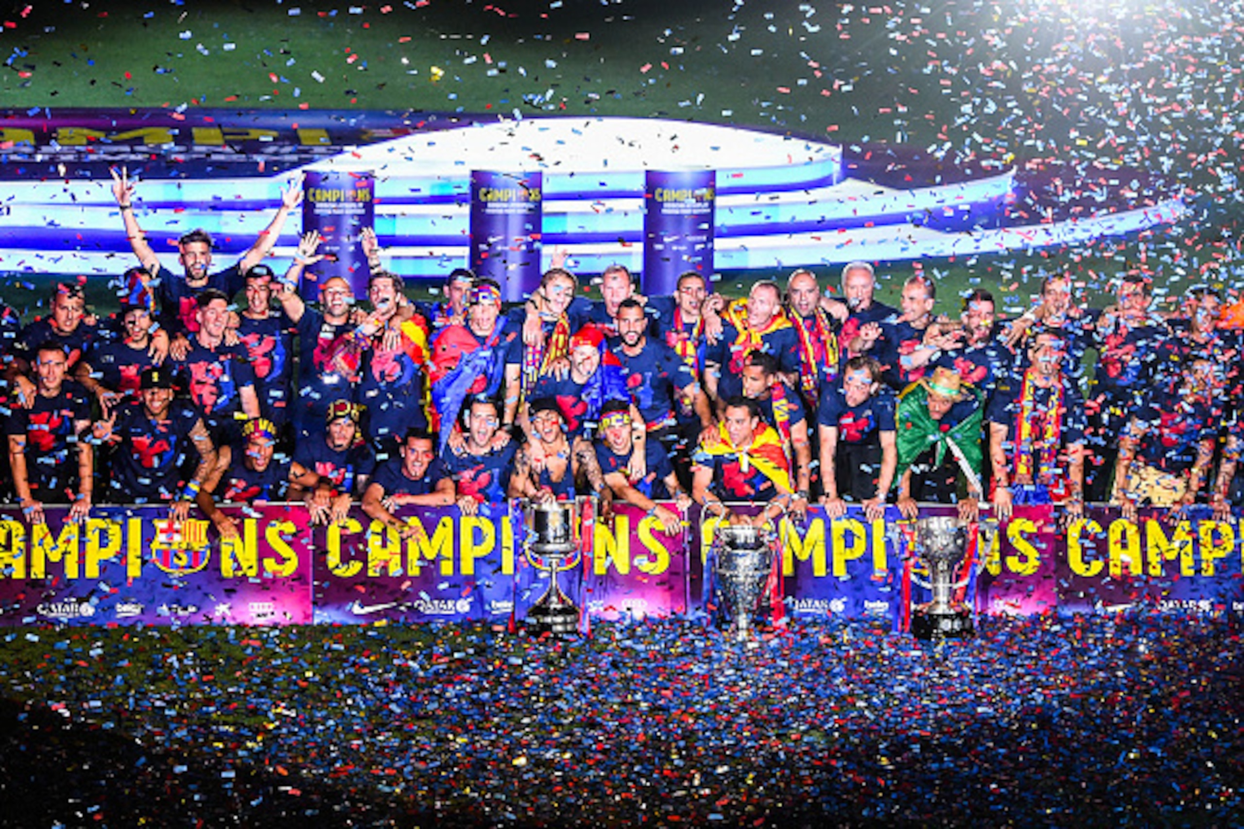 BARCELONA, SPAIN - JUNE 07: FC Barcelona players celebrate with La Liga, Copa del Rey and Champions League trophies during their victory parade after winning the UEFA Champions League Final at the Camp Nou Stadium on June 7, 2015 in Barcelona, Spain. (Pho BARCELONA, SPAIN - JUNE 07: FC Barcelona players celebrate with La Liga, Copa del Rey and Champions League trophies during their victory parade after winning the UEFA Champions League Final at the Camp Nou Stadium on June 7, 2015 in Barcelona, Spain. (Pho