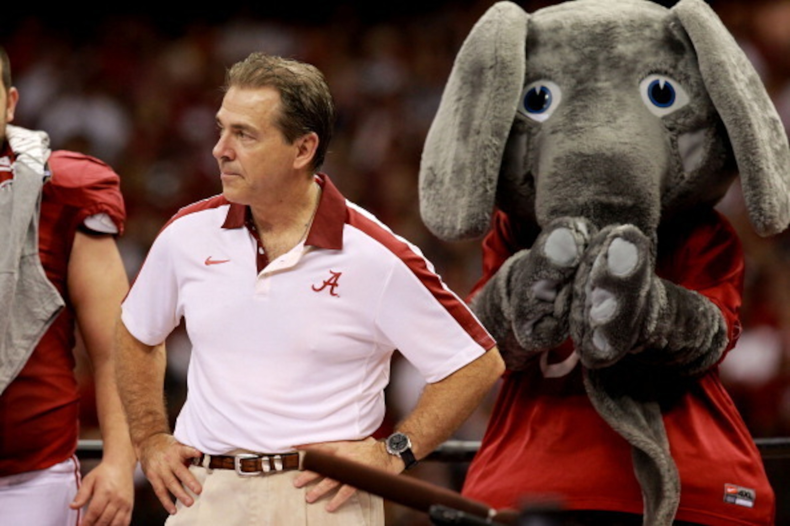NEW ORLEANS, LA - JANUARY 09:  Head coach Nick Saban of the Alabama Crimson Tide stands on the stage with the team mascot after defeating Louisiana State University Tigers in the 2012 Allstate BCS National Championship Game at Mercedes-Benz Superdome on J