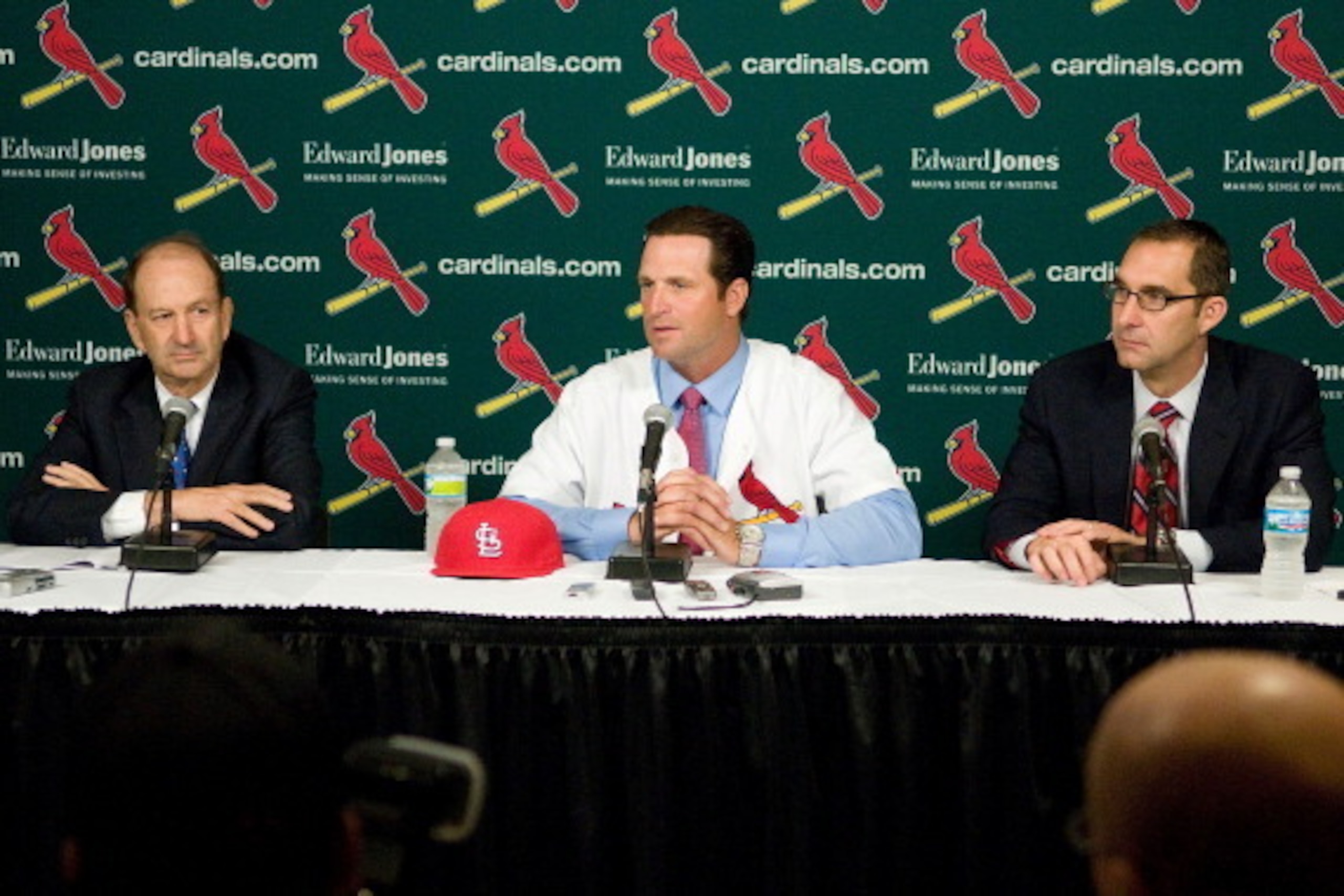 ST. LOUIS, MO - NOVEMBER 14:  St. Louis Cardinals owner Bill Dewitt Jr., Mike Matheny, and general manager John Mozeliak talk during a press conference to announce Matheny as the new manager of the Cardinals at Busch Stadium on November 14, 2011 in St. Lo