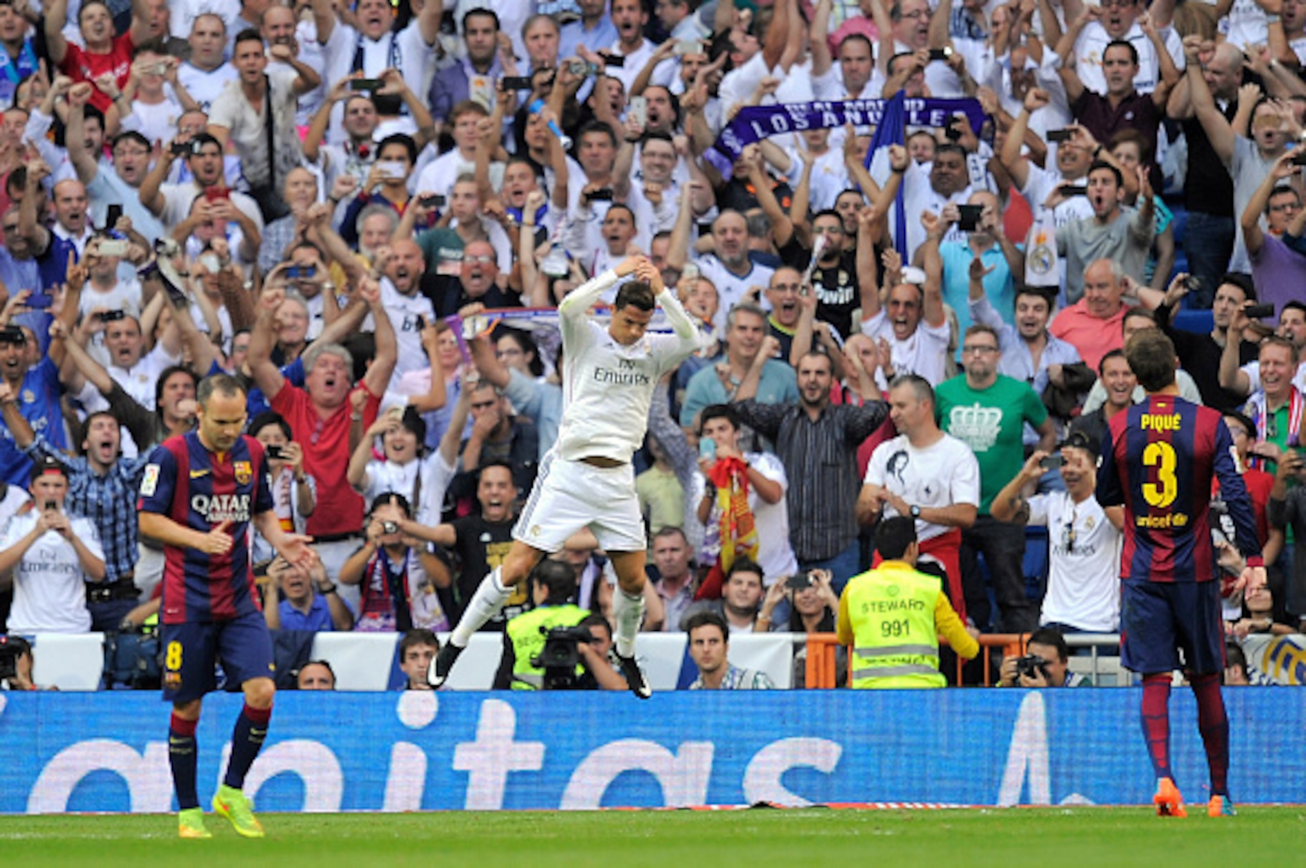 MADRID, SPAIN - OCTOBER 25:  Cristiano Ronaldo of Real Madrid CF celebrates after scoring his team's opening goal from the penalty spot during the La Liga match between Real Madrid CF and FC Barcelona at Estadio Santiago Bernabeu on October 25, 2014 in Ma