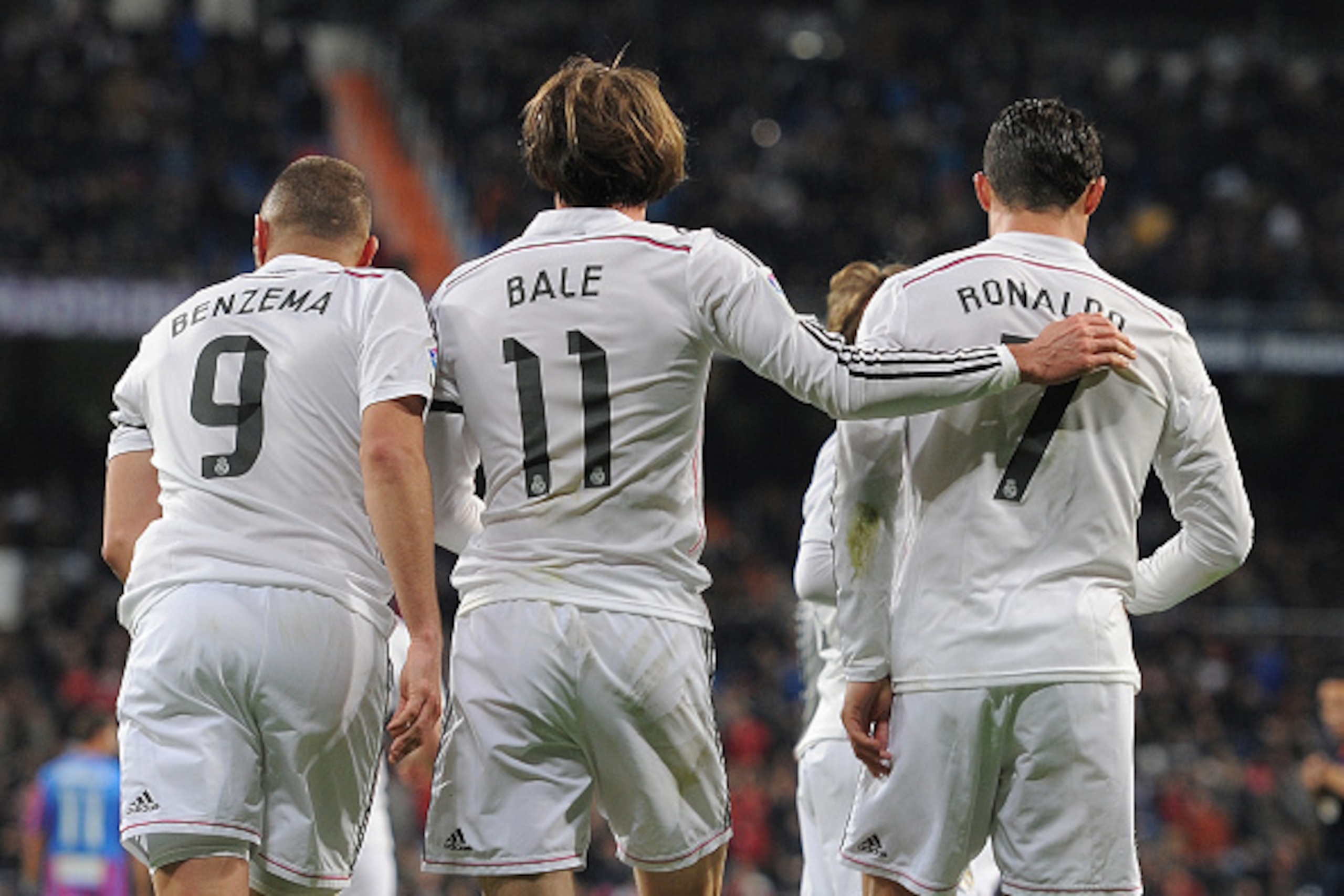 MADRID, SPAIN - MARCH 15:  Gareth Bale of Real Madrid celebrates with Cristiano Ronaldo and Karim Benzema  after scoring Real's opening goal during the La Liga match between Real Madrid CF and Levante UD at Estadio Santiago Bernabeu on March 15, 2015 in M