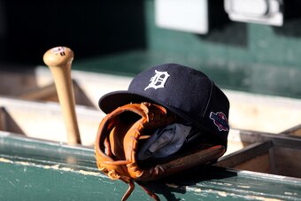 DETROIT, MI - OCTOBER 18:  A detail of a Detroit Tigers hat with an official postseason logo is seen on the bat rack in the udgout againstthe New York Yankees during game four of the American League Championship Series at Comerica Park on October 18, 2012