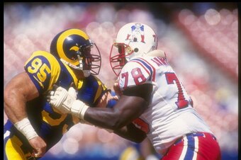 13 Sep 1992:  Offensive lineman Bruce Armstrong of the New England Patriots (right) blocks Los Angeles Rams defensive lineman Mike Piel during a game at Anaheim Stadium in Anaheim, California.  The Rams won the game, 14-0. Mandatory Credit: Gary Newkirk
