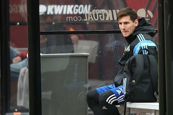 LANDOVER, MD - MARCH 27: Lionel Messi of the Argentinian national soccer team sits on the bench as his teammates practice on the field in preparation to take on El Salvador at FedExField on March 27, 2015 in Landover, Maryland. (Photo by Patrick Smith/Get