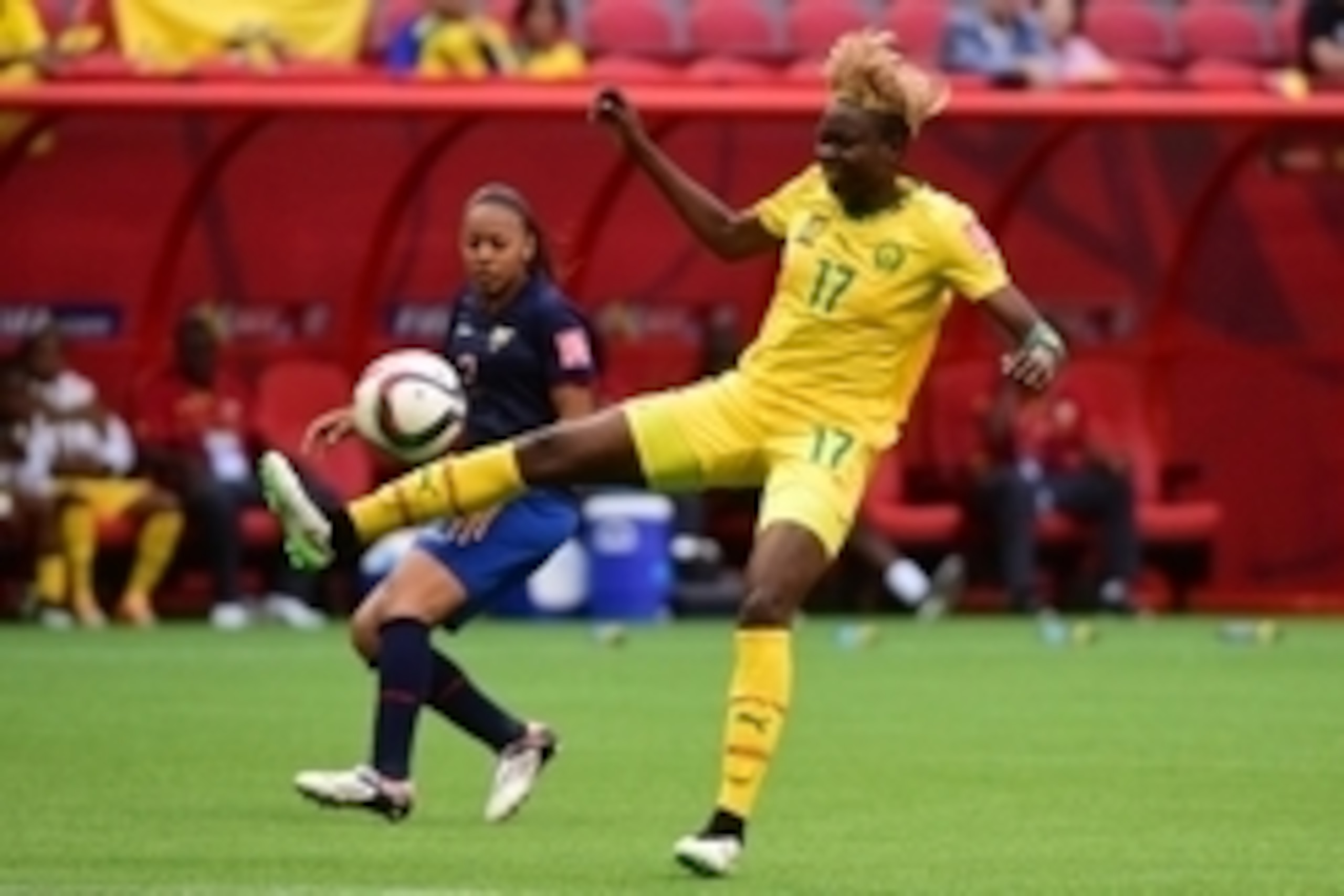 Jun 8, 2015; Vancouver, British Columbia, CAN; Cameroon forward Gaelle Enganamouit (17) kicks the ball in front of Ecuador defender Katherine Ortiz (2) during the second half in a Group C soccer match in the 2015 women's World Cup at BC Place Stadium. Man Jun 8, 2015; Vancouver, British Columbia, CAN; Cameroon forward Gaelle Enganamouit (17) kicks the ball in front of Ecuador defender Katherine Ortiz (2) during the second half in a Group C soccer match in the 2015 women's World Cup at BC Place Stadium. Man