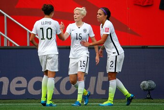 WINNIPEG, MB - JUNE 08:  Megan Rapinoe #15 celebrates with Carli Lloyd #10 and Sydney Leroux #2 of United States after Rapinoe scores her second goal against Australia in the second half during the FIFA Women's World Cup 2015 Group D match at Winnipeg Sta