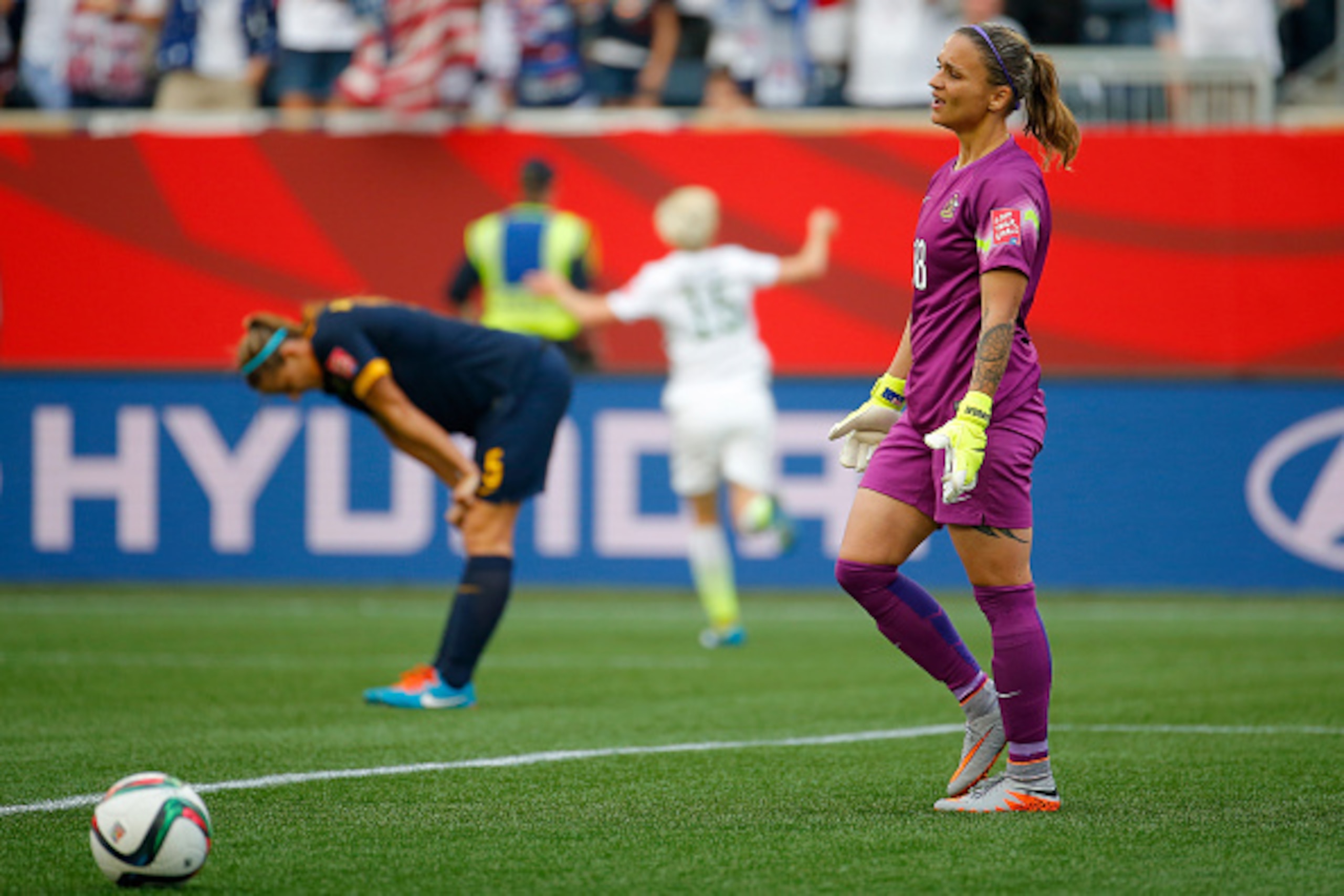 WINNIPEG, MB - JUNE 08:  Melissa Barbieri #18 and Laura Alleway #5 of Australia react after Megan Rapinoe #15 of United States scores her second goal of the match in the second half during the FIFA Women's World Cup 2015 Group D match at Winnipeg Stadium 