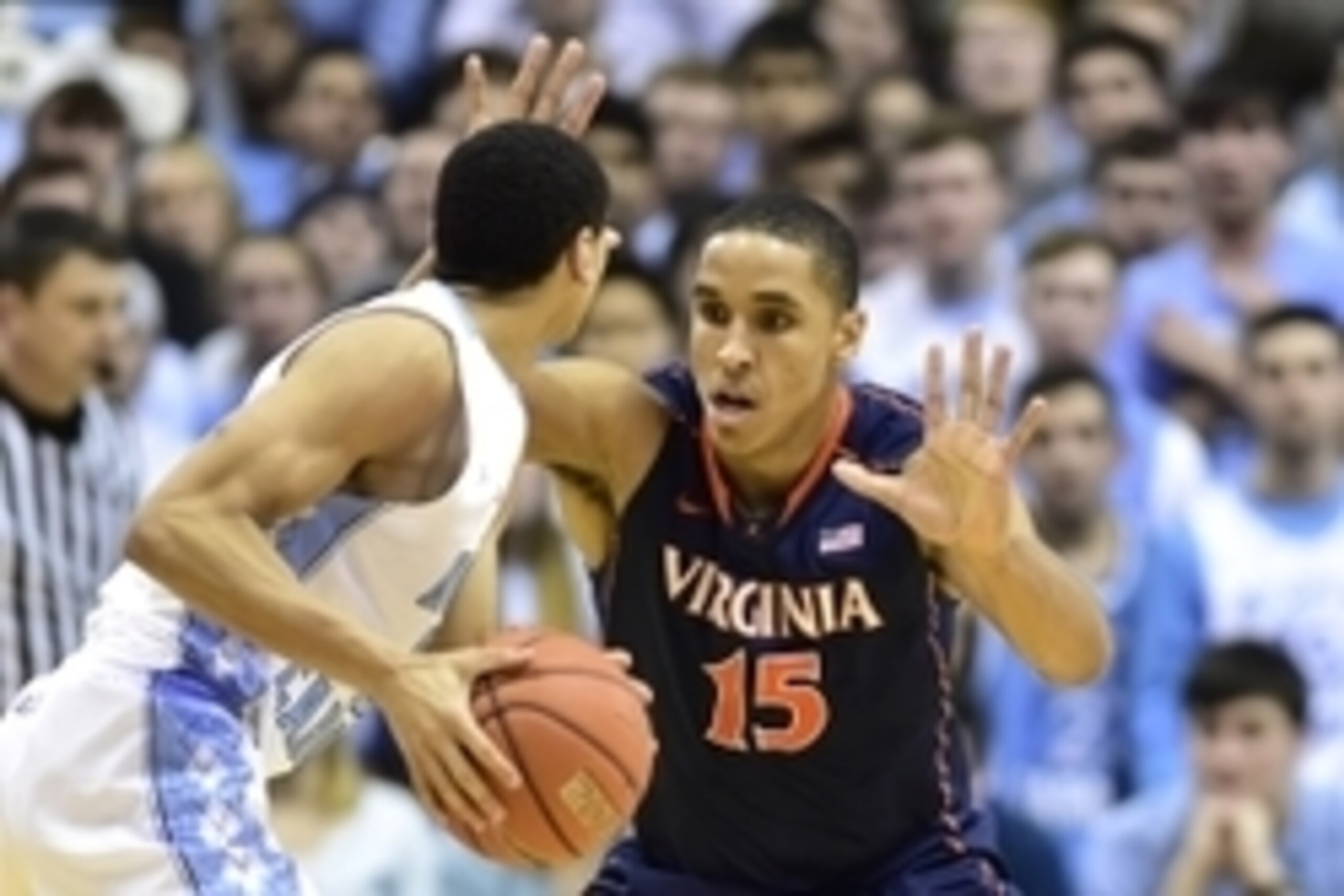 Feb 2, 2015; Chapel Hill, NC, USA; North Carolina Tar Heels guard Marcus Paige (5) with the ball as Virginia Cavaliers guard Malcolm Brogdon (15) defends in the second half. The Cavaliers defeated the Tar Heels 75-64 at Dean E. Smith Center. Mandatory Cre Feb 2, 2015; Chapel Hill, NC, USA; North Carolina Tar Heels guard Marcus Paige (5) with the ball as Virginia Cavaliers guard Malcolm Brogdon (15) defends in the second half. The Cavaliers defeated the Tar Heels 75-64 at Dean E. Smith Center. Mandatory Cre