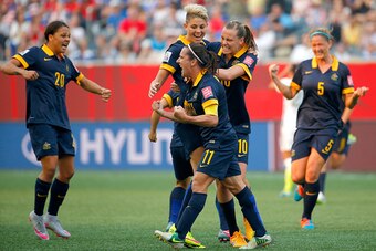 WINNIPEG, MB - JUNE 08:  Lisa De Vanna #11 of Australia celebrates her first half goal with teammates against the United States during the FIFA Women's World Cup 2015 Group D match at Winnipeg Stadium on June 8, 2015 in Winnipeg, Canada.  (Photo by Kevin 