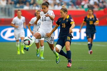 WINNIPEG, MB - JUNE 08:  Carli Lloyd #10 of United States with the ball against Katrina Gorry #19 of Australia in the second half during the FIFA Women's World Cup 2015 Group D match at Winnipeg Stadium on June 8, 2015 in Winnipeg, Canada.  (Photo by Kevi