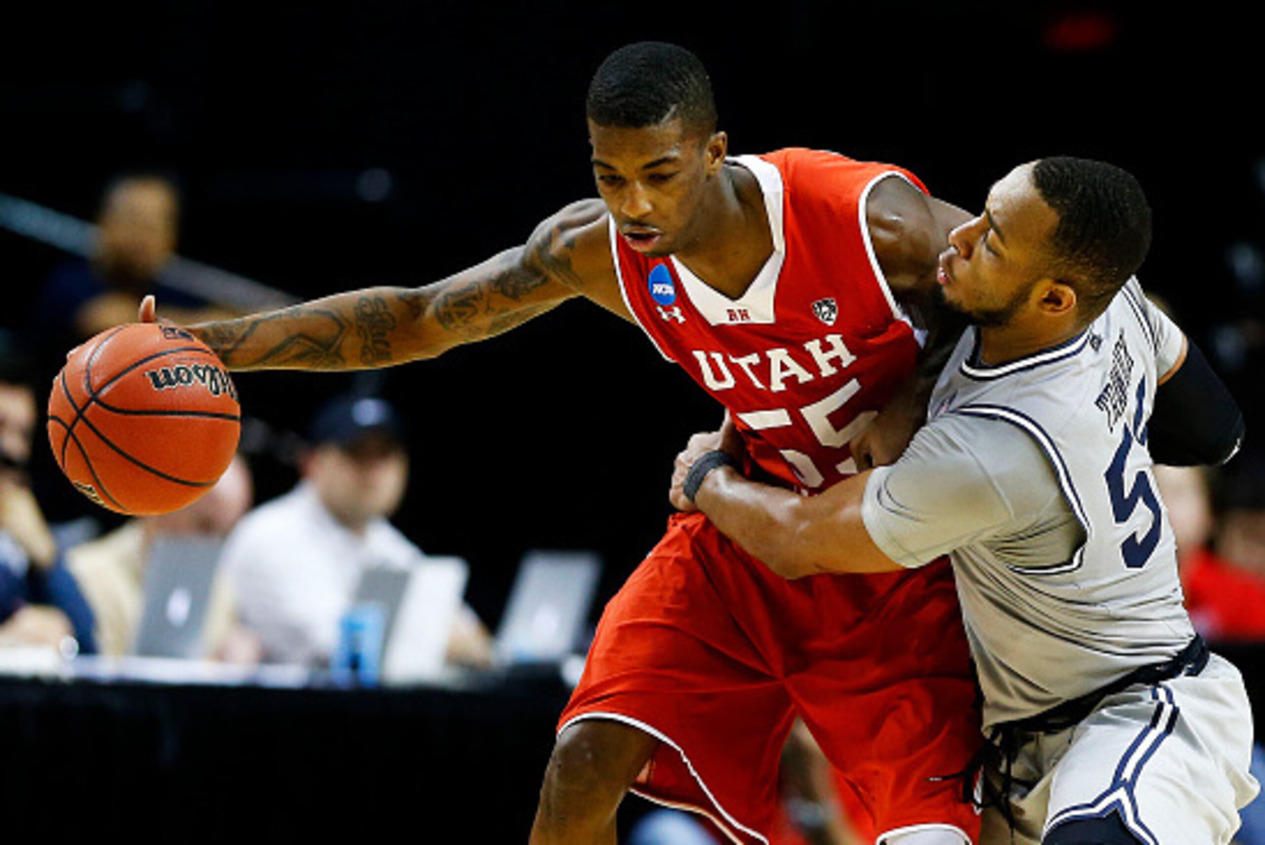 PORTLAND, OR - MARCH 21:  Delon Wright #55 of the Utah Utes drives against Jabril Trawick #55 of the Georgetown Hoyas in the second half during the third round of the 2015 NCAA Men's Basketball Tournament at Moda Center on March 21, 2015 in Portland, Oreg