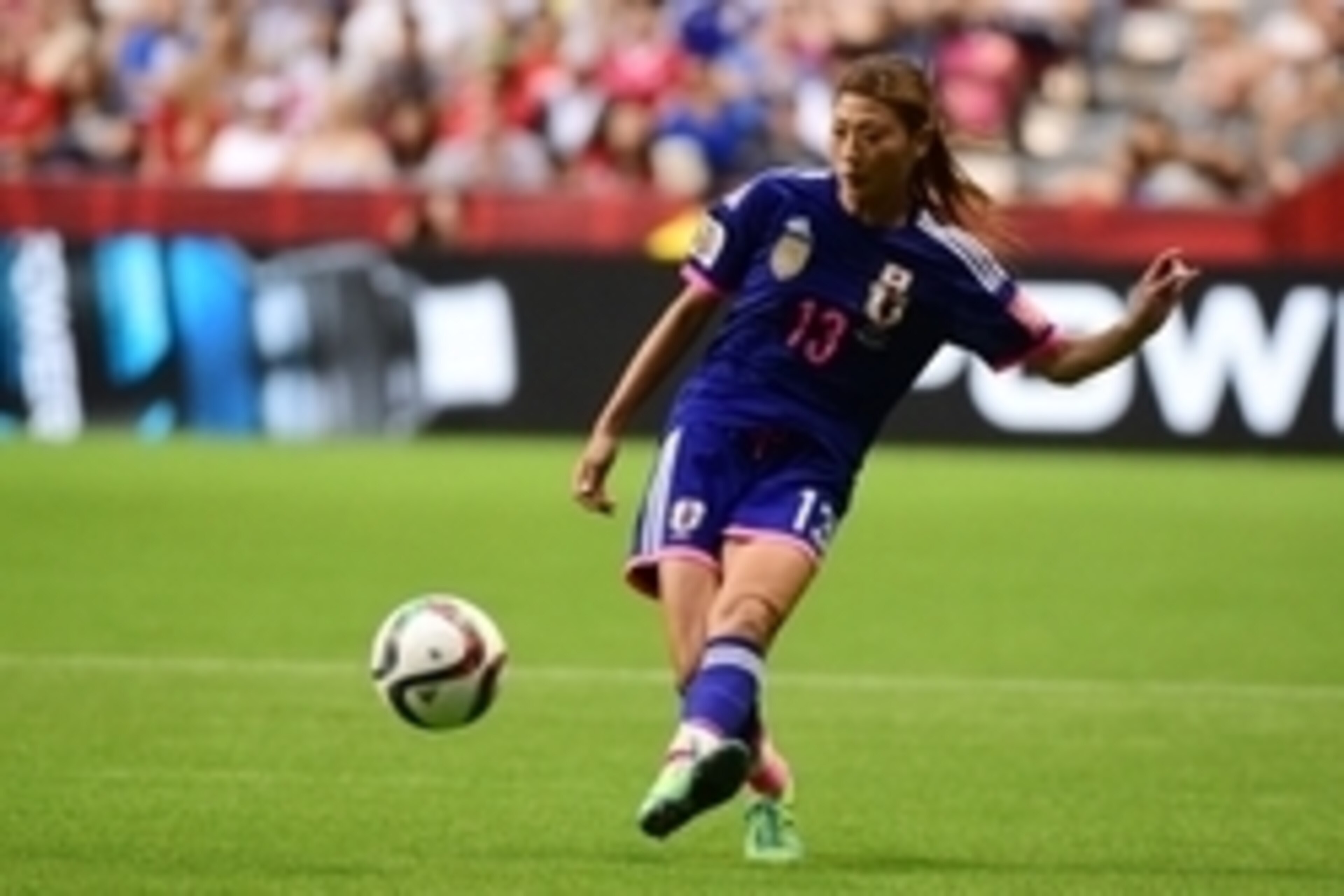 Jun 8, 2015; Vancouver, British Columbia, CAN; Japan midfielder Rumi Utsugi (13) kicks the ball against Switzerland during the second half in a Group C soccer match in the 2015 women's World Cup at BC Place Stadium. Mandatory Credit: Anne-Marie Sorvin-USA