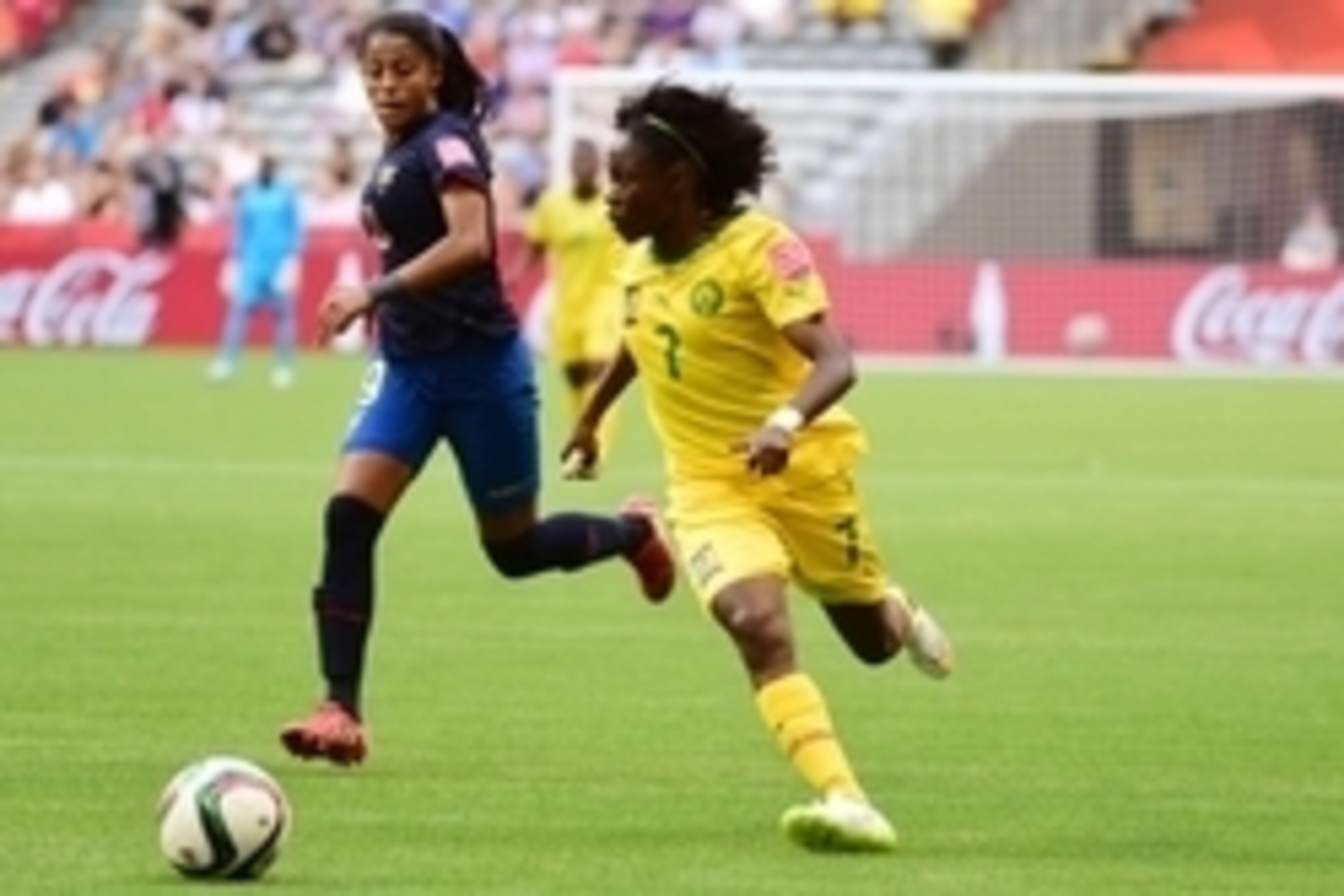 Jun 8, 2015; Vancouver, British Columbia, CAN; Cameroon forward Gabrielle Onguene (7) dribbles the ball in front of Ecuador midfielder Kerlly Real (19) during the second half in a Group C soccer match in the 2015 women's World Cup at BC Place Stadium. Man