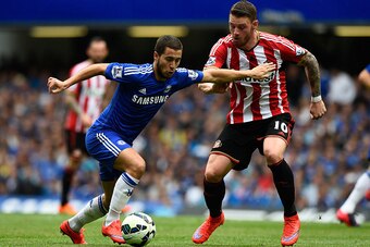 LONDON, ENGLAND - MAY 24: Eden Hazard of Chelsea and Connor Wickham of Sunderland compete for the ball during the Barclays Premier League match between Chelsea and Sunderland at Stamford Bridge on May 24, 2015 in London, England.  (Photo by Mike Hewitt/Ge