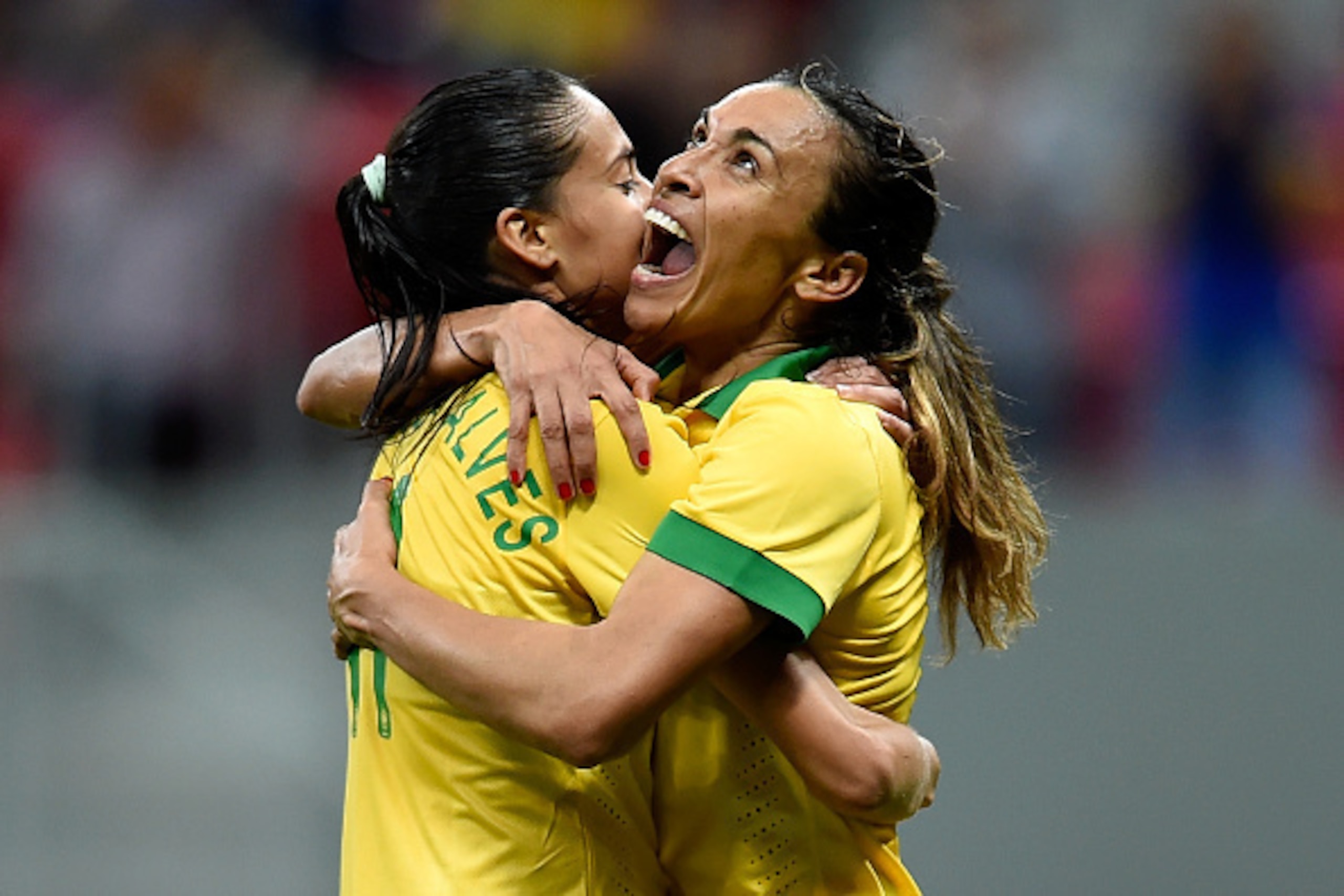 BRASILIA, BRAZIL - DECEMBER 10:  Marta (R) and Andressa of Brazil celebrate the victory against Argentina during a match between Brazil and Argentina as part of International Women's Football Tournament of Brasilia at Mane Garrincha Stadium on December 10