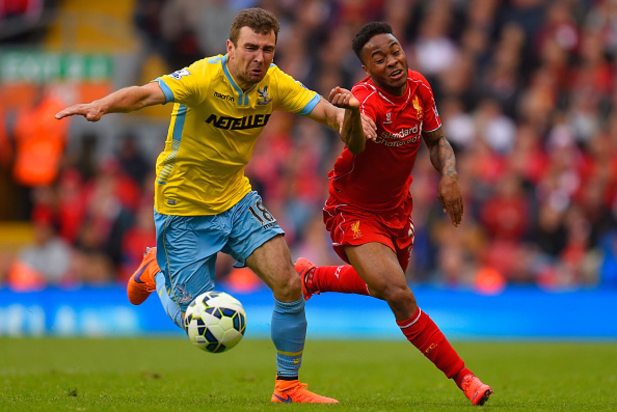 LIVERPOOL, ENGLAND - MAY 16: James McArthur of Crystal Palace and Raheem Sterling of Liverpool tussle for the ball during the Barclays Premier League match between Liverpool and Crystal Palace at Anfield on May 16, 2015 in Liverpool, England.  (Photo by S