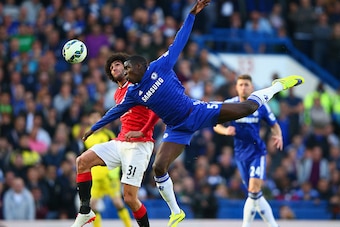 LONDON, ENGLAND - APRIL 18:  Marouane Fellaini of Manchester United and Kurt Zouma of Chelsea battle for the ball during the Barclays Premier League match between Chelsea and Manchester United at Stamford Bridge on April 18, 2015 in London, England.  (Pho