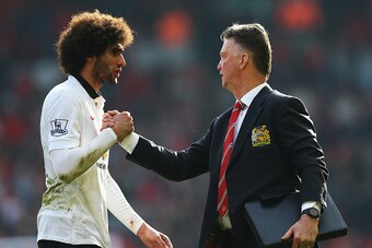 LIVERPOOL, ENGLAND - MARCH 22:  Louis van Gaal, manager of Manchester United celebrates with Marouane Fellaini of Manchester United after the Barclays Premier League match between Liverpool and Manchester United at Anfield on March 22, 2015 in Liverpool, 
