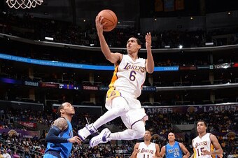 LOS ANGELES, CA - APRIL 12:  Jordan Clarkson #6 of the Los Angeles Lakers goes to the basket against the Dallas Mavericks on April 12, 2015 at Staples Center in Los Angeles, California. NOTE TO USER: User expressly acknowledges and agrees that, by downloa