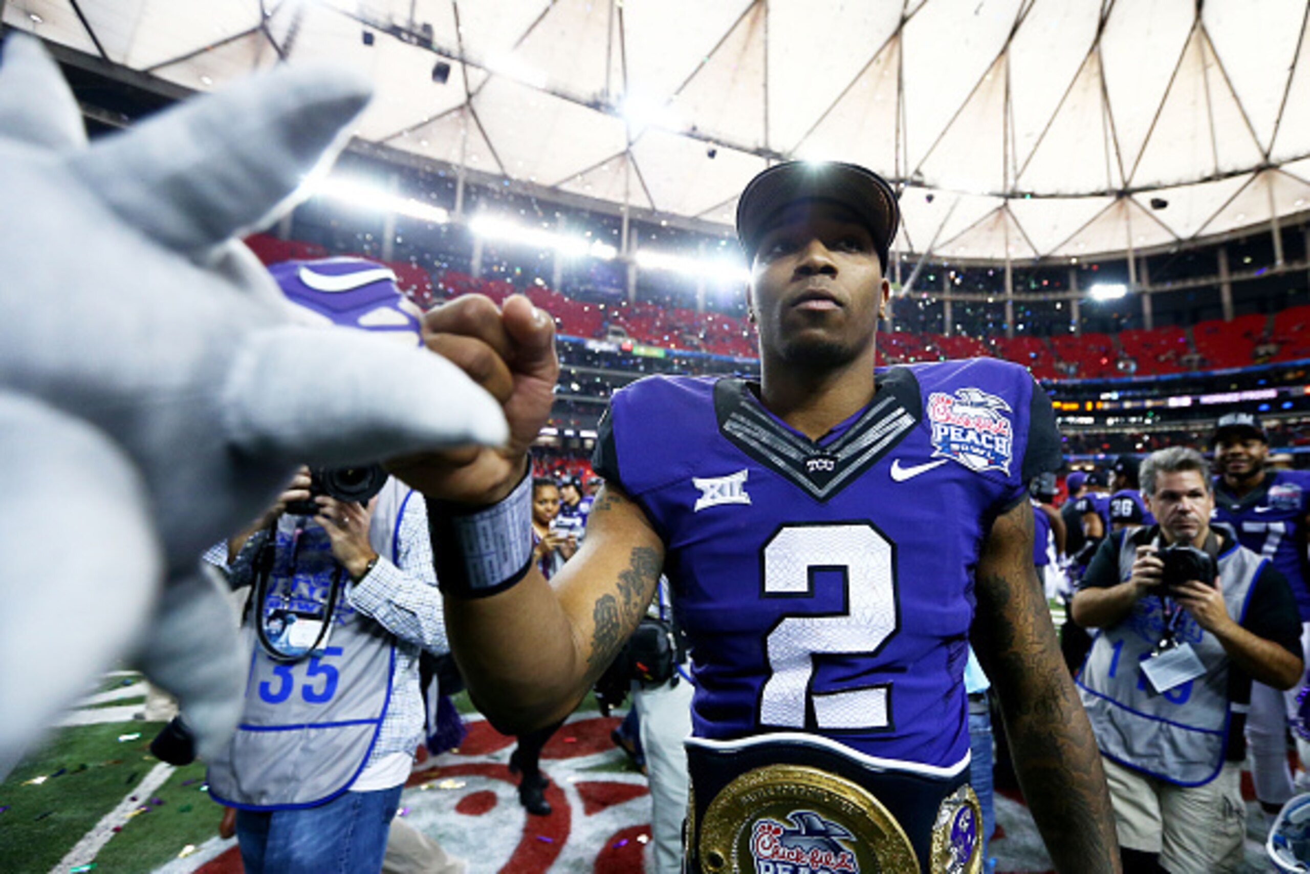 ATLANTA, GA - DECEMBER 31:  Trevone Boykin #2 of the TCU Horned Frogs celebrates after their 42 to 3 win over the Ole Miss Rebels during the Chik-fil-A Peach Bowl at Georgia Dome on December 31, 2014 in Atlanta, Georgia.  (Photo by Streeter Lecka/Getty Im
