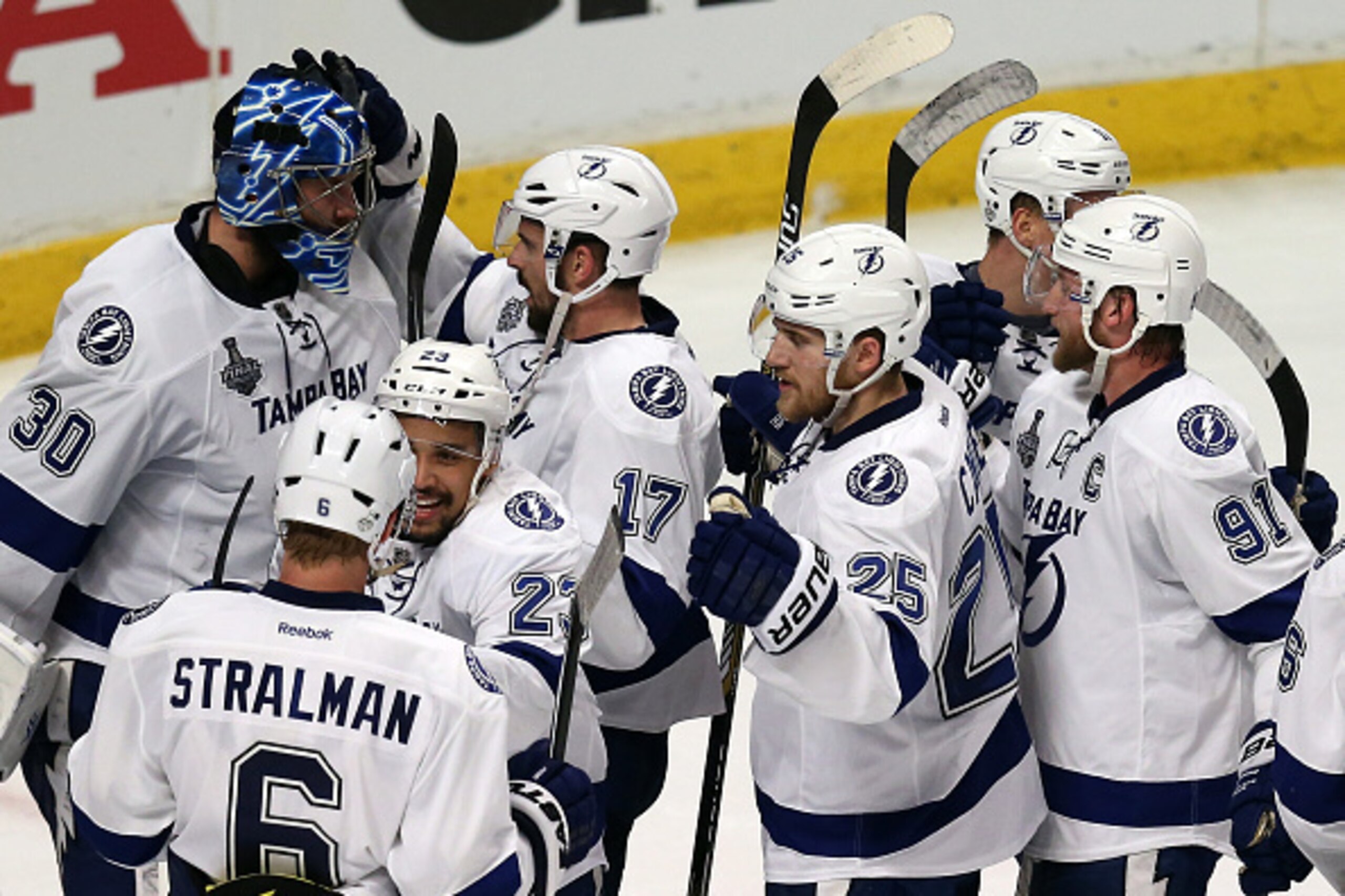 CHICAGO, IL - JUNE 08:  Ben Bishop #30 of the Tampa Bay Lightning celebrates with his teammates after defeating the Chicago Blackhawks 3-2 in Game Three of the 2015 NHL Stanley Cup Final at the United Center on June 8, 2015 in Chicago, Illinois.  (Photo b