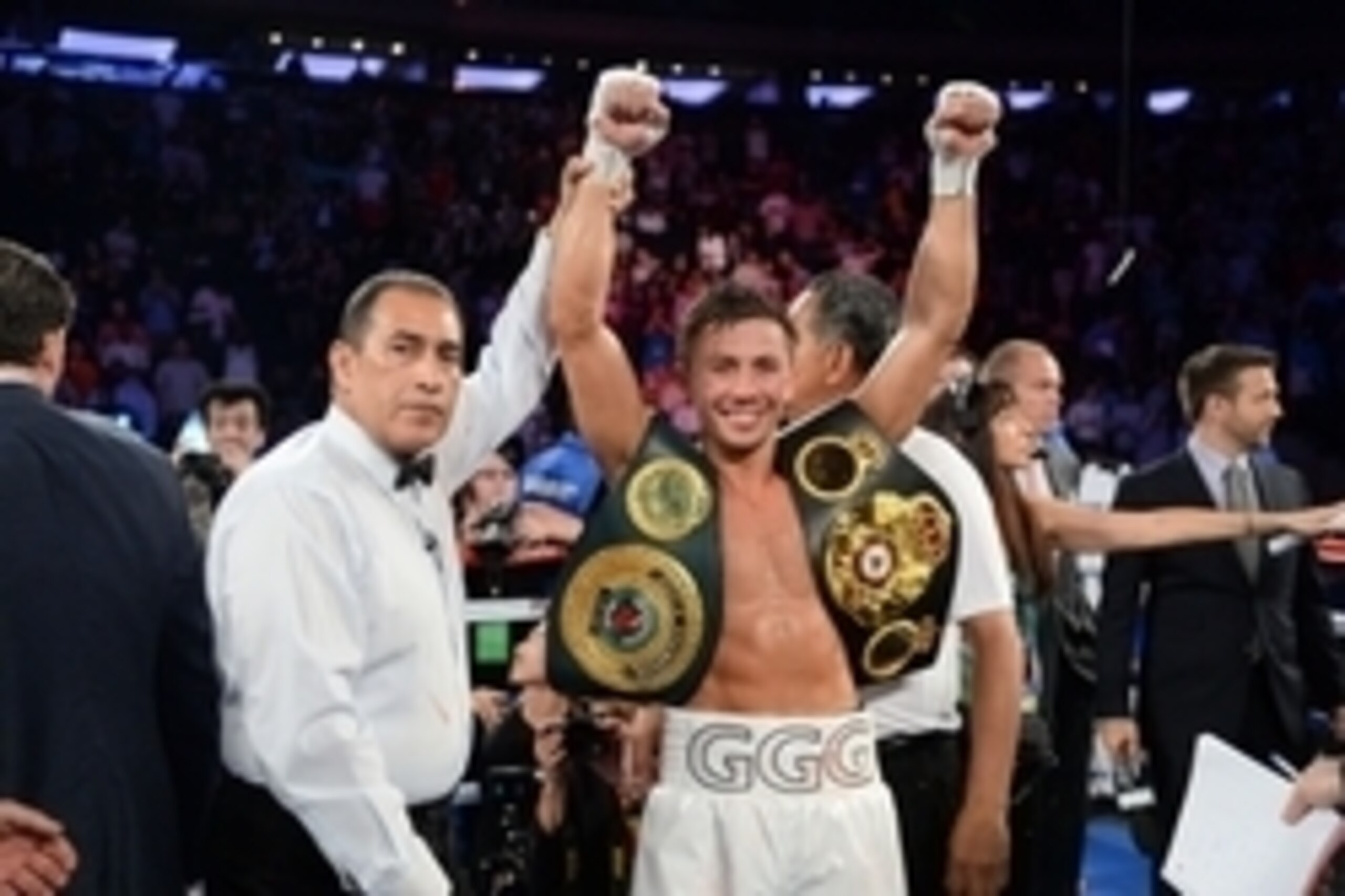 Jul 26, 2014; New York, NY, USA; Gennady Golovkin (white gloves) reacts after knocking out Daniel Geale (black gloves) during their middleweight championship bout at Madison Square Garden. Golovkin won via third round knockout. Mandatory Credit: Joe Campo