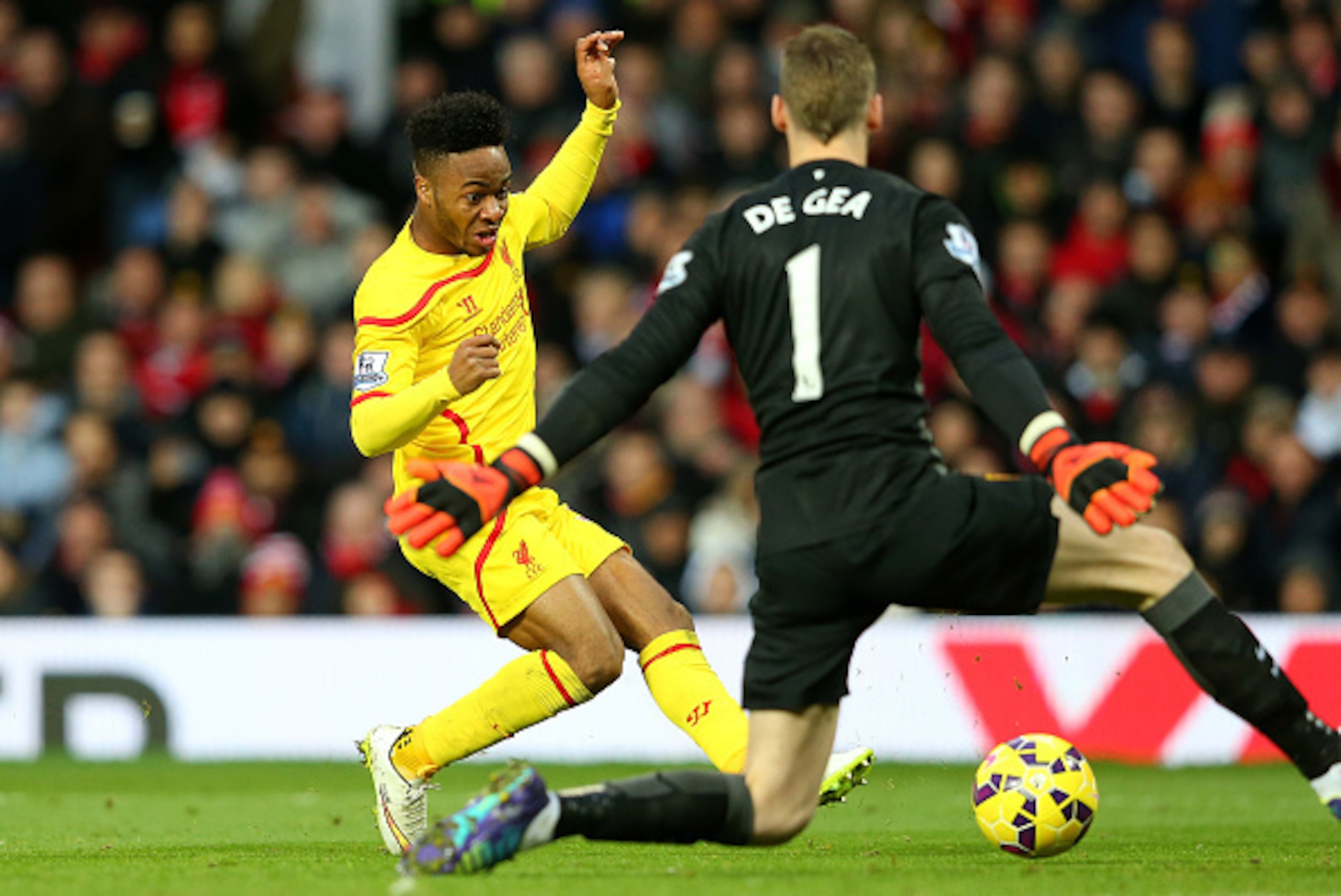 MANCHESTER, ENGLAND - DECEMBER 14:  Dvid De Gea of Manchester United saves the attempt on goal of Raheem Sterling of Liverpool in a one on one situation during the Barclays Premier League match between Manchester United and Liverpool at Old Trafford on De