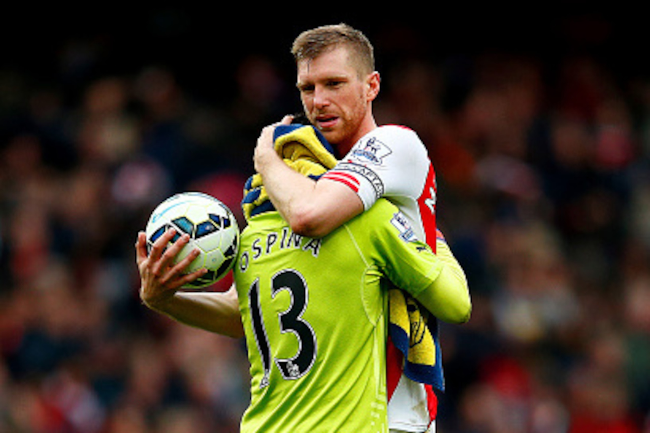 LONDON, ENGLAND - APRIL 04: Per Mertesacker of Arsenal celebrates with David Ospina of Arsenal after the Barclays Premier League match between Arsenal and Liverpool at Emirates Stadium on April 4, 2015 in London, England.  (Photo by Julian Finney/Getty Im