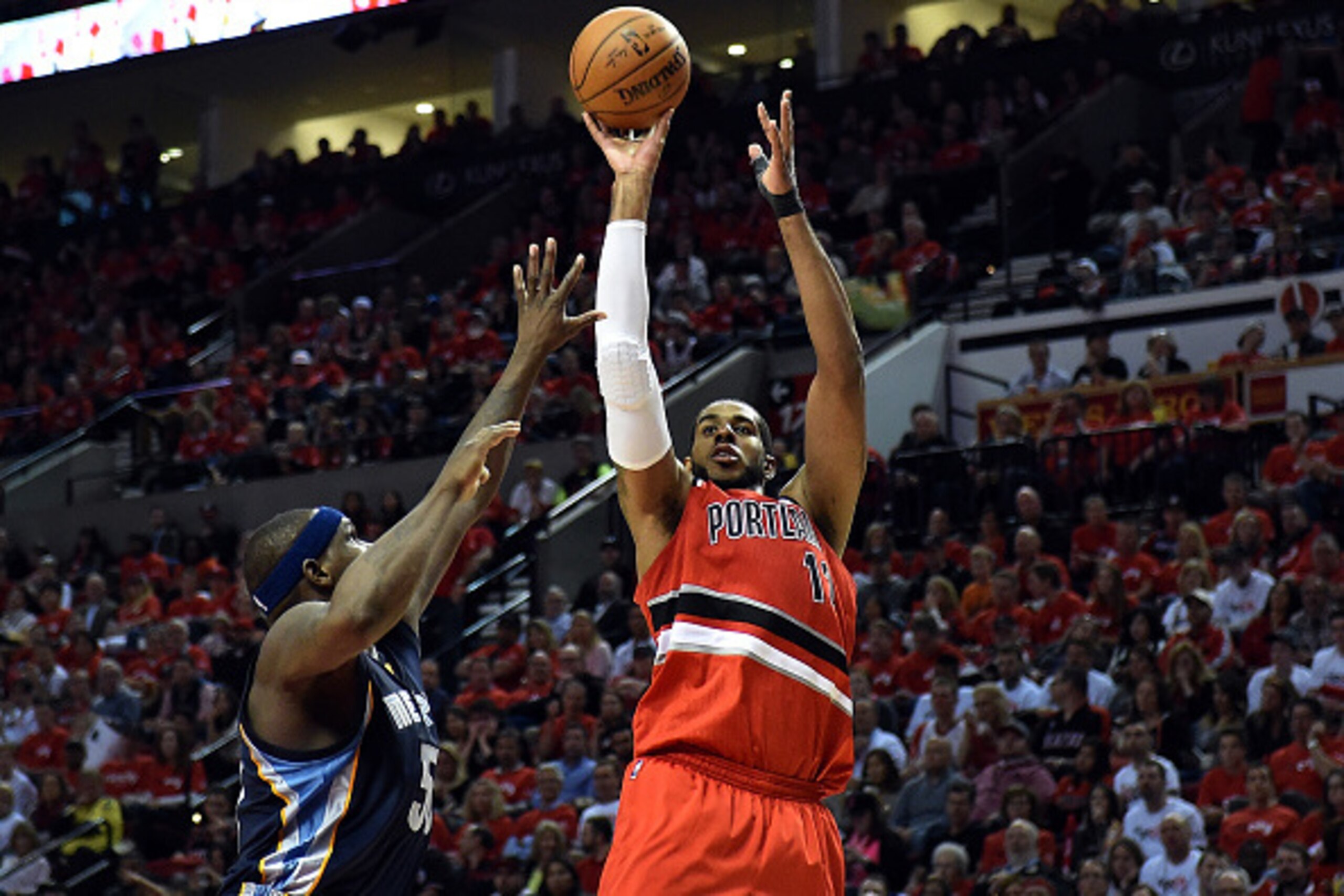 PORTLAND, OR - APRIL 25: LaMarcus Aldridge #12 of the Portland Trail Blazers shoots the ball on Zach Randolph #50 of the Memphis Grizzlies during the fourth quarter in Game Three of the Western Conference quarterfinals during the 2015 NBA Playoffs at the 