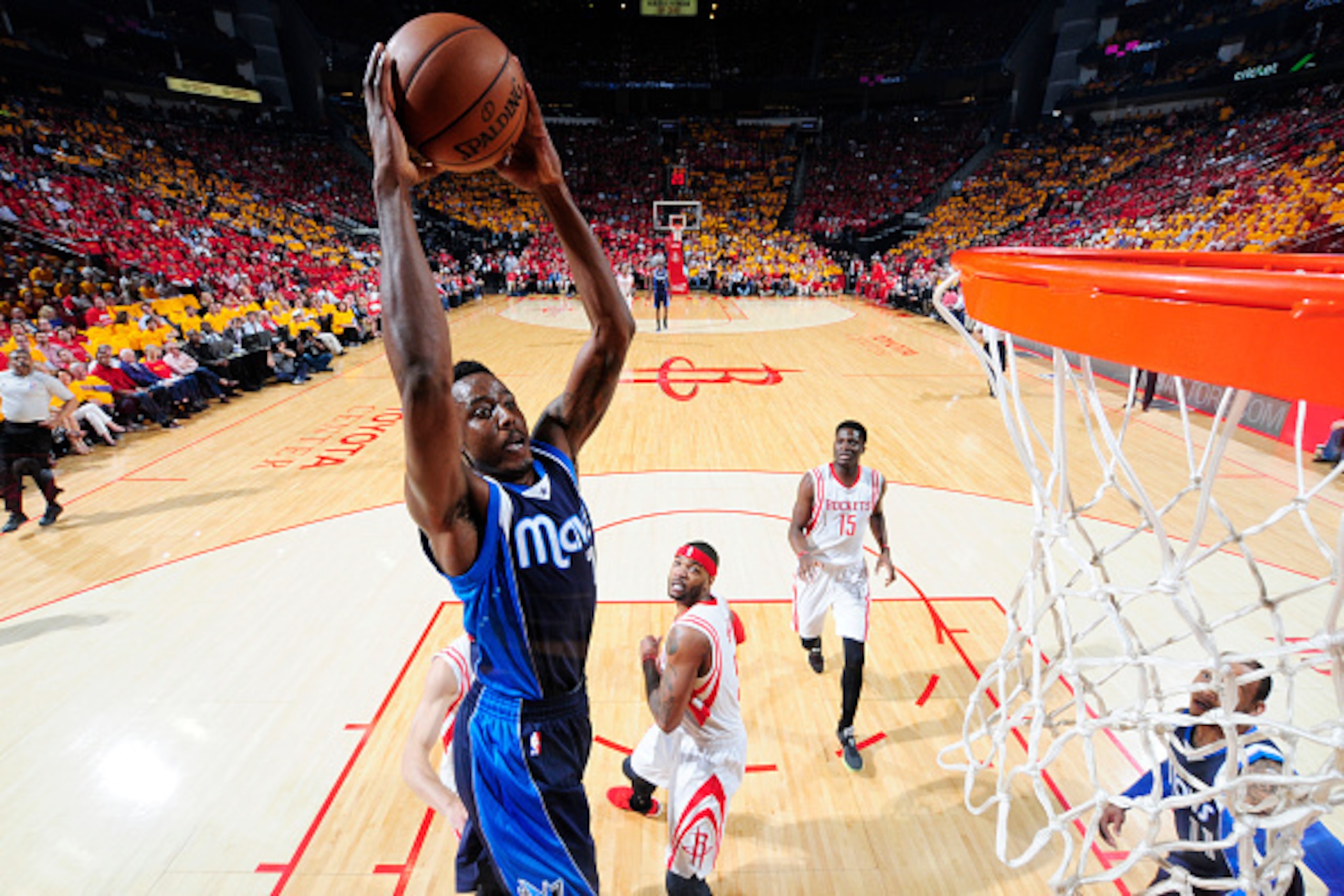 HOUSTON, TX - APRIL 28: Al-Farouq Aminu #7 of the Dallas Mavericks dunks against the Houston Rockets in Game Five of the Western Conference Quarterfinals during the NBA Playoffs on April 28, 2015 at the Toyota Center in Houston, Texas. NOTE TO USER: User 