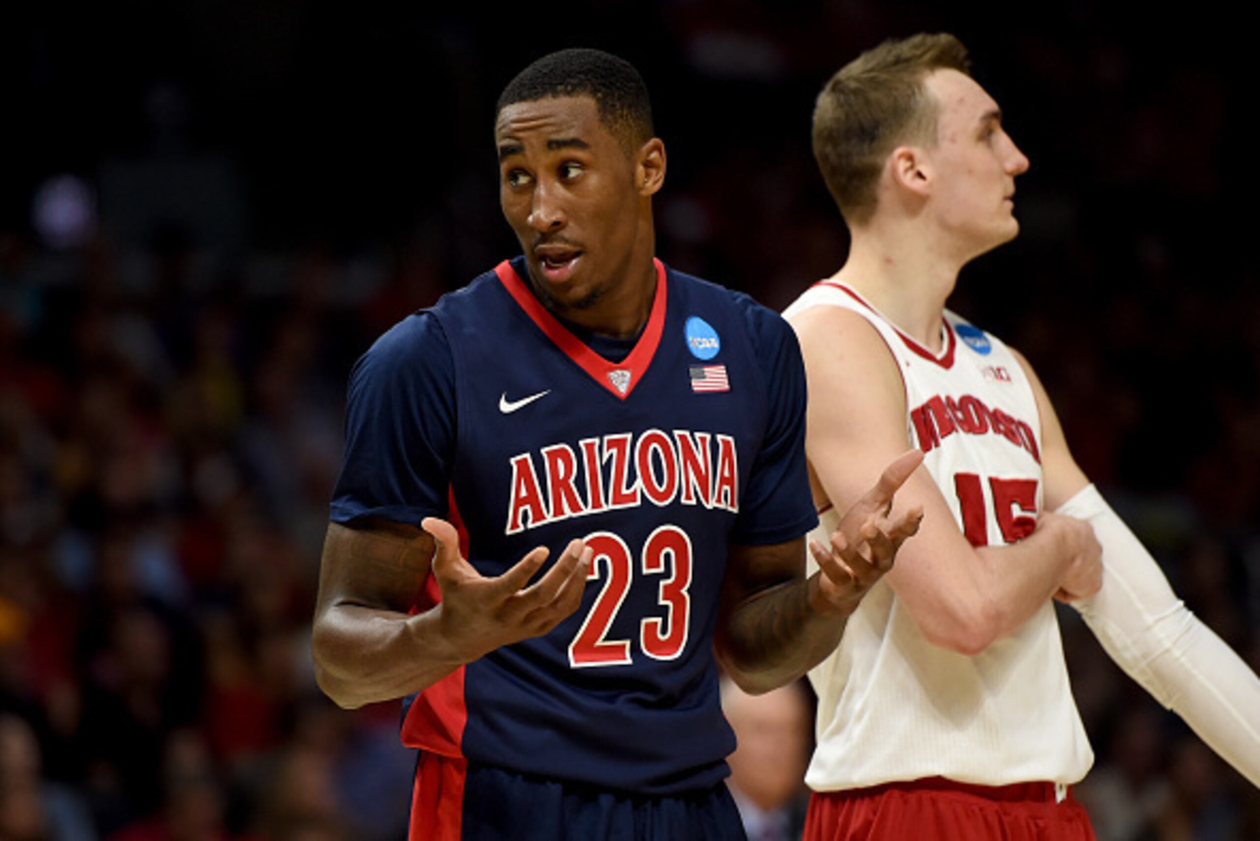 LOS ANGELES, CA - MARCH 28: Rondae Hollis-Jefferson #23 of the Arizona Wildcats reacts in the second half while standing alongside Sam Dekker #15 of the Wisconsin Badgers during the West Regional Final of the 2015 NCAA Men's Basketball Tournament at Stap LOS ANGELES, CA - MARCH 28: Rondae Hollis-Jefferson #23 of the Arizona Wildcats reacts in the second half while standing alongside Sam Dekker #15 of the Wisconsin Badgers during the West Regional Final of the 2015 NCAA Men's Basketball Tournament at Stap