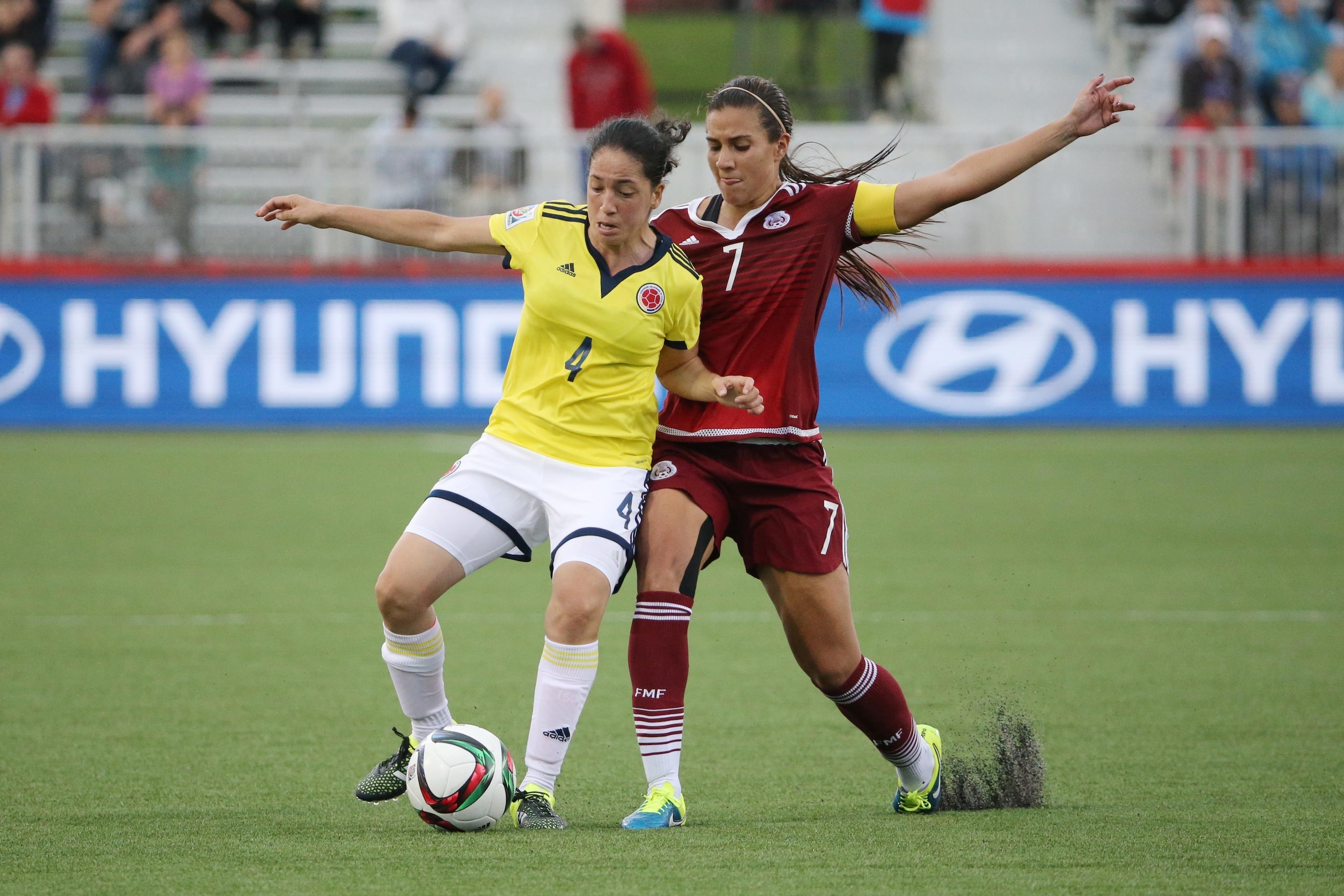 Jun 9, 2015; Moncton, New Brunswick, CAN; Colombia midfielder Diana Ospina (4) battles for the ball with Mexico midfielder Nayeli Rangel (7) during the second half in a Group F soccer match in the 2015 FIFA women's World Cup at Moncton Stadium. Mandatory Jun 9, 2015; Moncton, New Brunswick, CAN; Colombia midfielder Diana Ospina (4) battles for the ball with Mexico midfielder Nayeli Rangel (7) during the second half in a Group F soccer match in the 2015 FIFA women's World Cup at Moncton Stadium. Mandatory