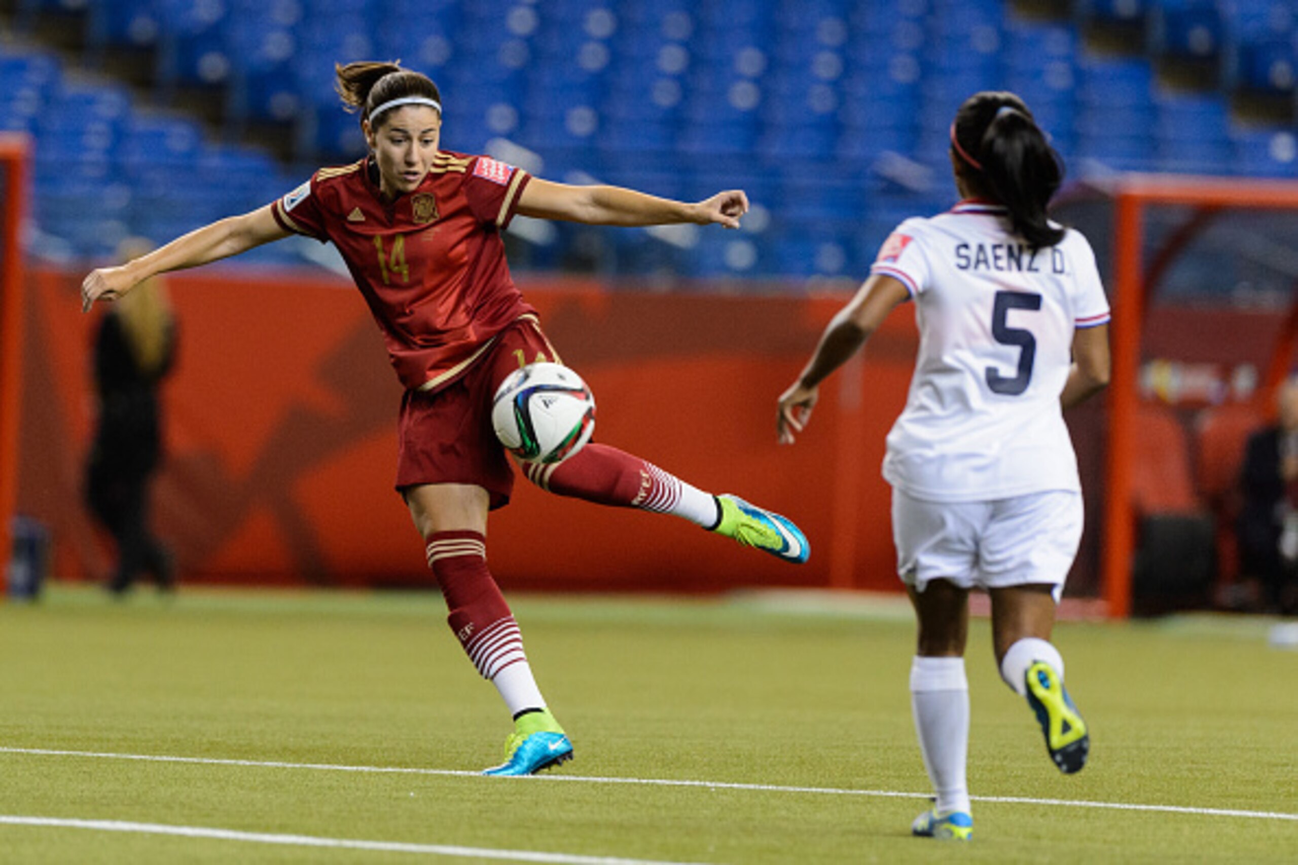 MONTREAL, QC - JUNE 09: Vicky Losada #14 of Spain kicks the ball near Diana Saenz #5 of Costa Rica during the 2015 FIFA Women's World Cup Group E match at Olympic Stadium on June 9, 2015 in Montreal, Quebec, Canada. (Photo by Minas Panagiotakis/Getty Ima MONTREAL, QC - JUNE 09: Vicky Losada #14 of Spain kicks the ball near Diana Saenz #5 of Costa Rica during the 2015 FIFA Women's World Cup Group E match at Olympic Stadium on June 9, 2015 in Montreal, Quebec, Canada. (Photo by Minas Panagiotakis/Getty Ima