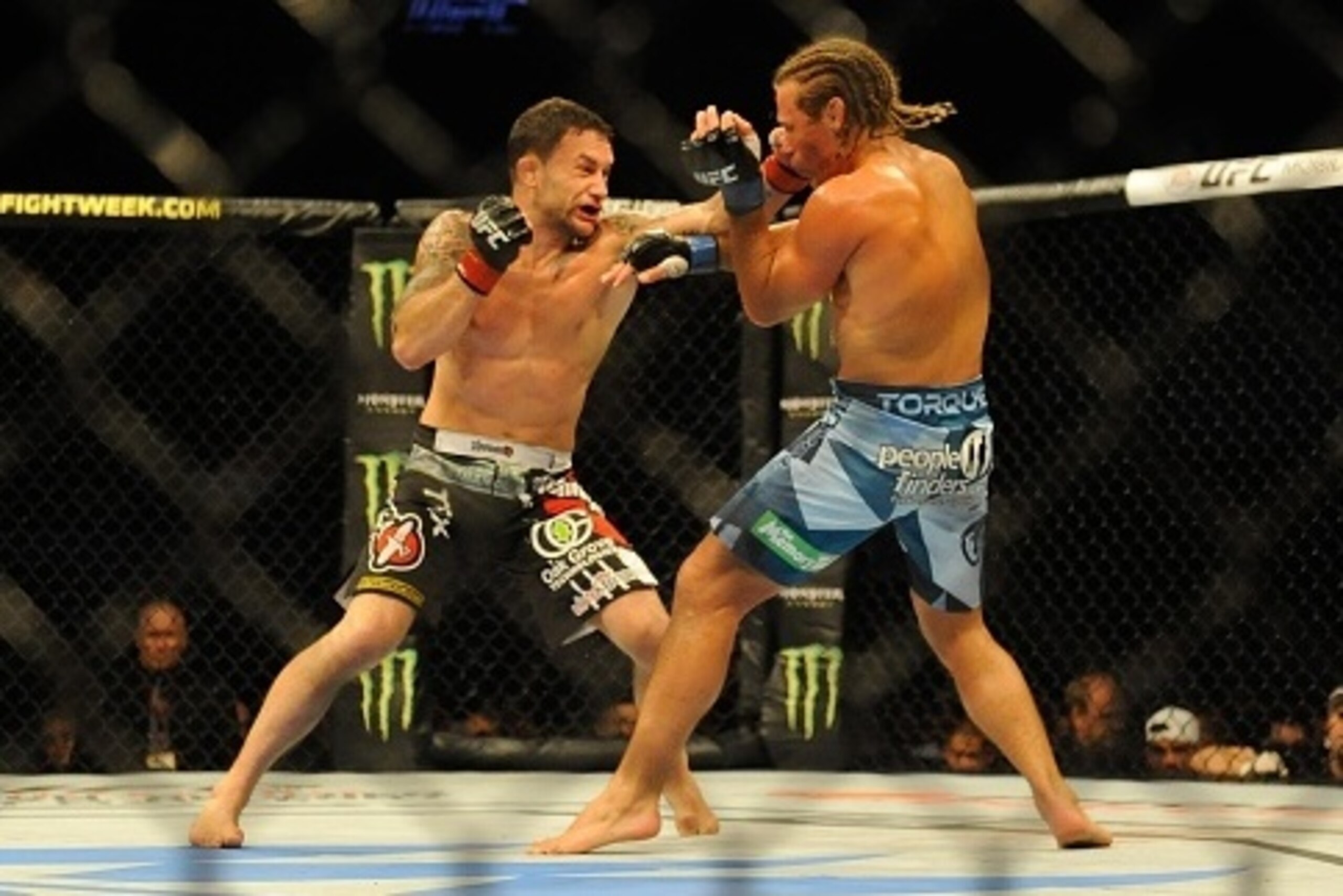 MANILA, PHILIPPINES - MAY 16:  Uriah Faber grapples with Frankie Edgar in their featherweight bout during the UFC Fight Night event at the Mall Of Asia Arena on May 16, 2015 in Manila, Philippines.  (Photo by Dondi Tawatao/Getty Images)