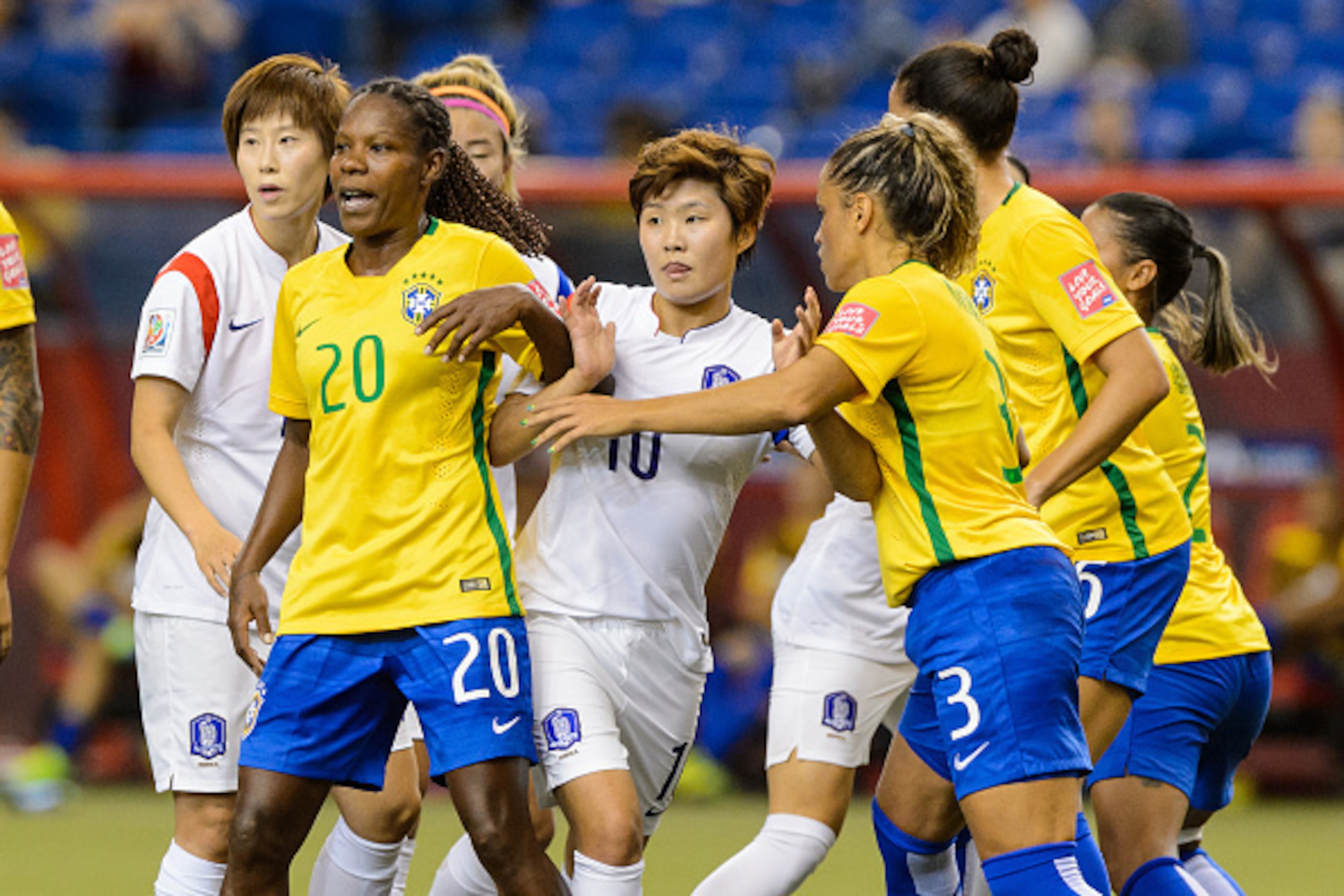 MONTREAL, QC - JUNE 09:  Members from Brazil and Korea Republic battle for position in the first half during the 2015 FIFA Women's World Cup Group E match at Olympic Stadium on June 9, 2015 in Montreal, Quebec, Canada. (Photo by Minas Panagiotakis/Getty I