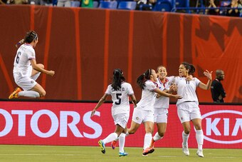 MONTREAL, QC - JUNE 09:  Raquel Rodriguez Cedeno #11 of Costa Rica celebrates her goal with teammates during the 2015 FIFA Women's World Cup Group E match against Spain at Olympic Stadium on June 9, 2015 in Montreal, Quebec, Canada. (Photo by Minas Panagi
