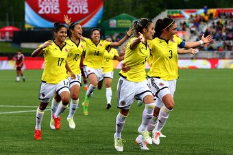 MONCTON, NB - JUNE 09:  Daniela Montoya #6 of Colombia celebrates her goal with teammates in the second half against Mexico during the FIFA Women's World Cup 2015 Group F match at Moncton Stadium on June 9, 2015 in Moncton, Canada.  (Photo by Elsa/Getty I