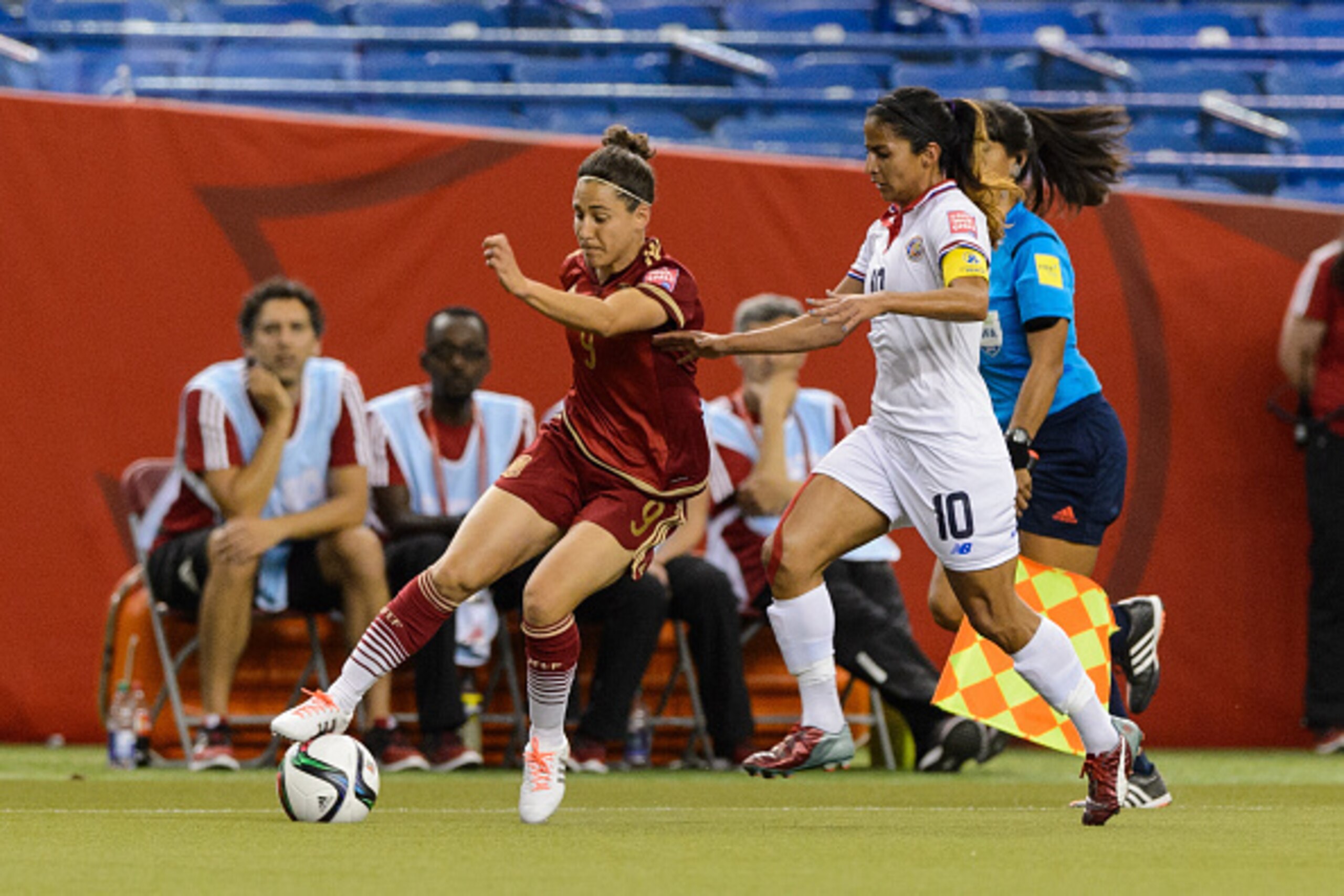 MONTREAL, QC - JUNE 09:  Veronica Boquete #9 of Spain tries to move the ball past Shirley Cruz #10 of Costa Rica during the 2015 FIFA Women's World Cup Group E match at Olympic Stadium on June 9, 2015 in Montreal, Quebec, Canada. (Photo by Minas Panagiota