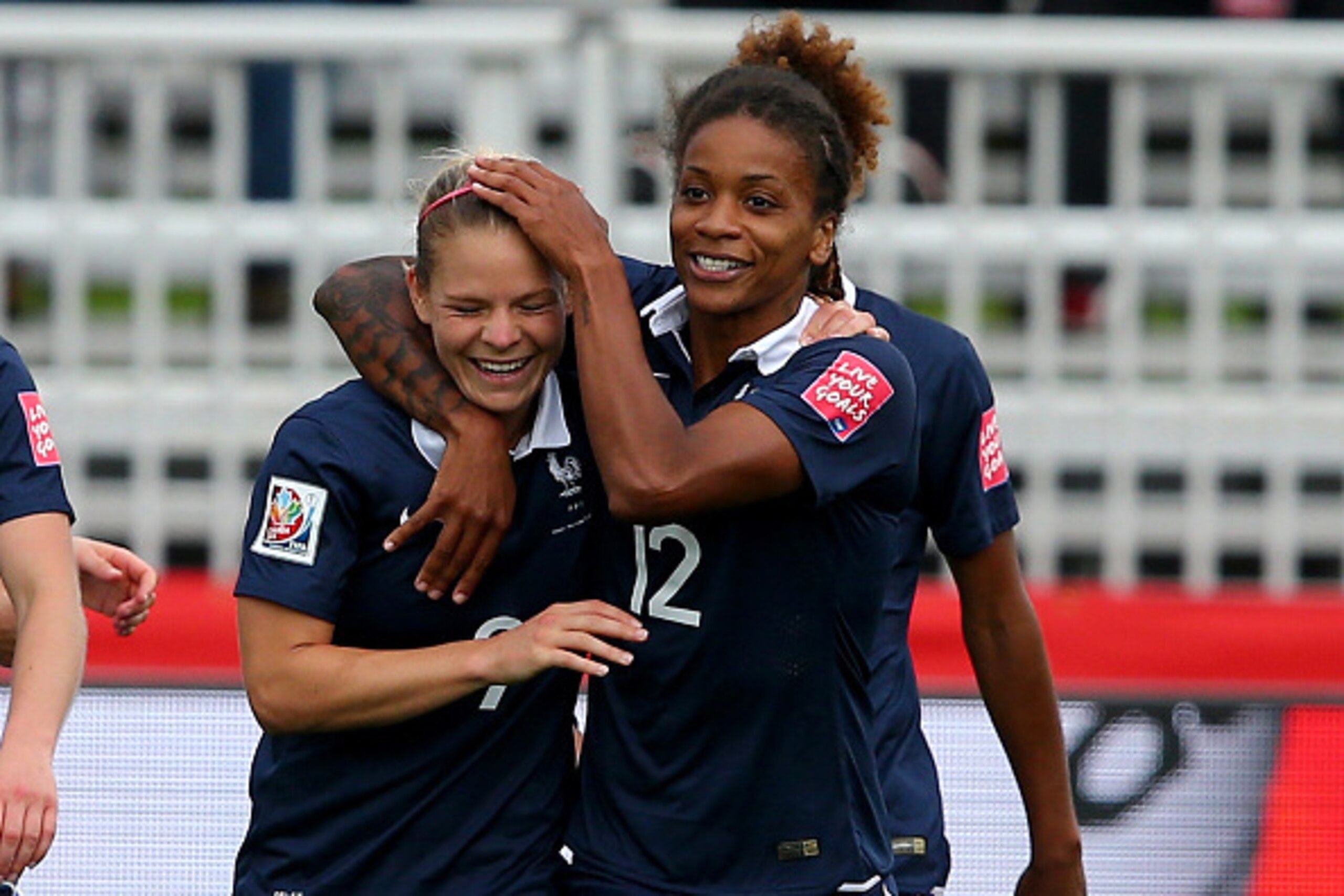 MONCTON, NB - JUNE 09:  Eugenie Le #9 of France is congratulated by teammate Elodie Thomis #12 after Le scored in the first half against England during the FIFA Women's World Cup 2015 Group F match at Moncton Stadium on June 9, 2015 in Moncton, Canada.  (