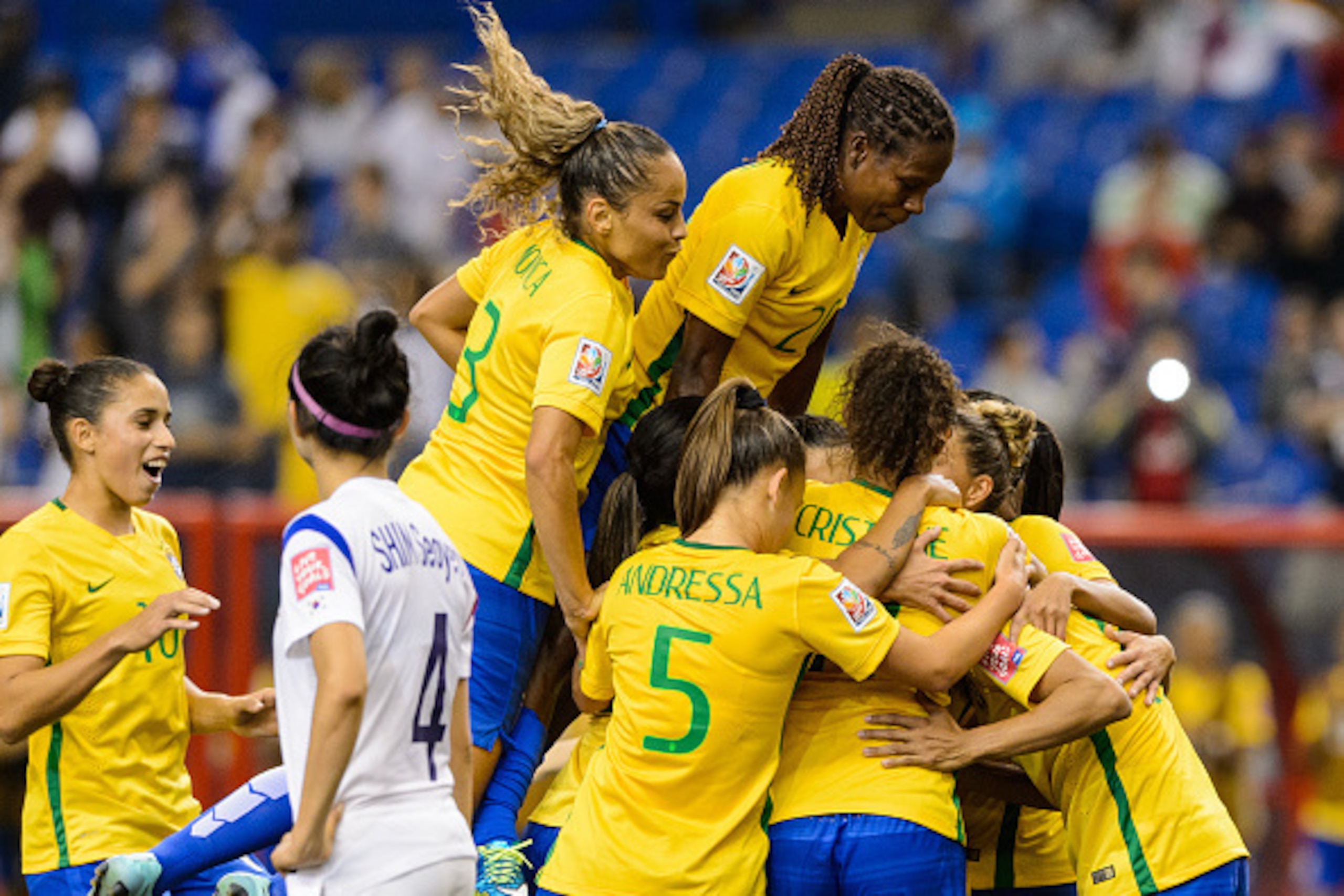 MONTREAL, QC - JUNE 09:  Marta #10 of Brazil celebrates a goal on a penalty kick with teammates in the second half during the 2015 FIFA Women's World Cup Group E match against Korea Republic at Olympic Stadium on June 9, 2015 in Montreal, Quebec, Canada. 