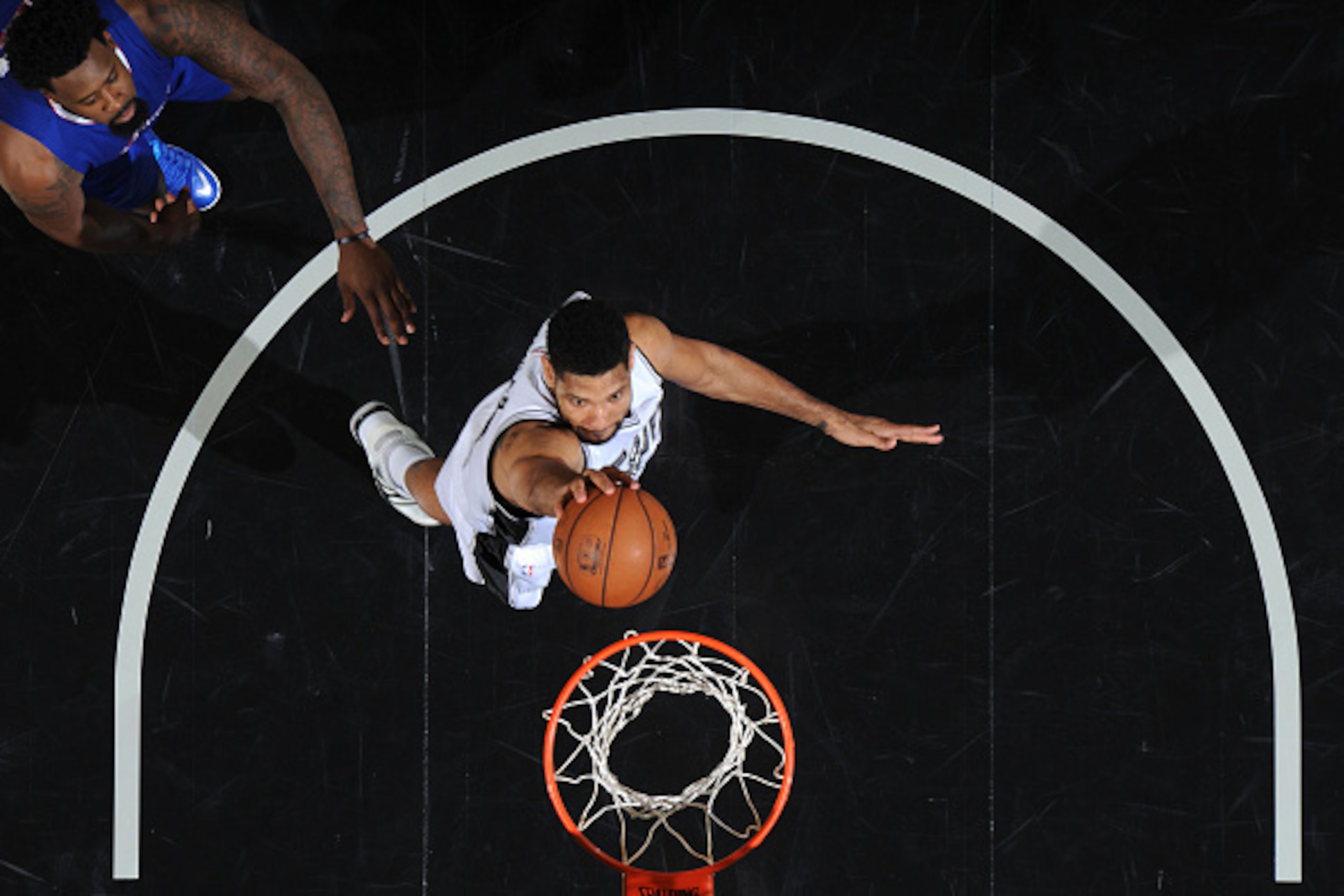 SAN ANTONIO, TEXAS - April 30: Tim Duncan #21 of the San Antonio Spurs shoots against the Los Angeles Clippers during Game Six of the Western Conference Quarterfinals during the NBA Playoffs on April 30, 2015 at Barclays Center in San Antonio, Texas. NOT SAN ANTONIO, TEXAS - April 30: Tim Duncan #21 of the San Antonio Spurs shoots against the Los Angeles Clippers during Game Six of the Western Conference Quarterfinals during the NBA Playoffs on April 30, 2015 at Barclays Center in San Antonio, Texas. NOT