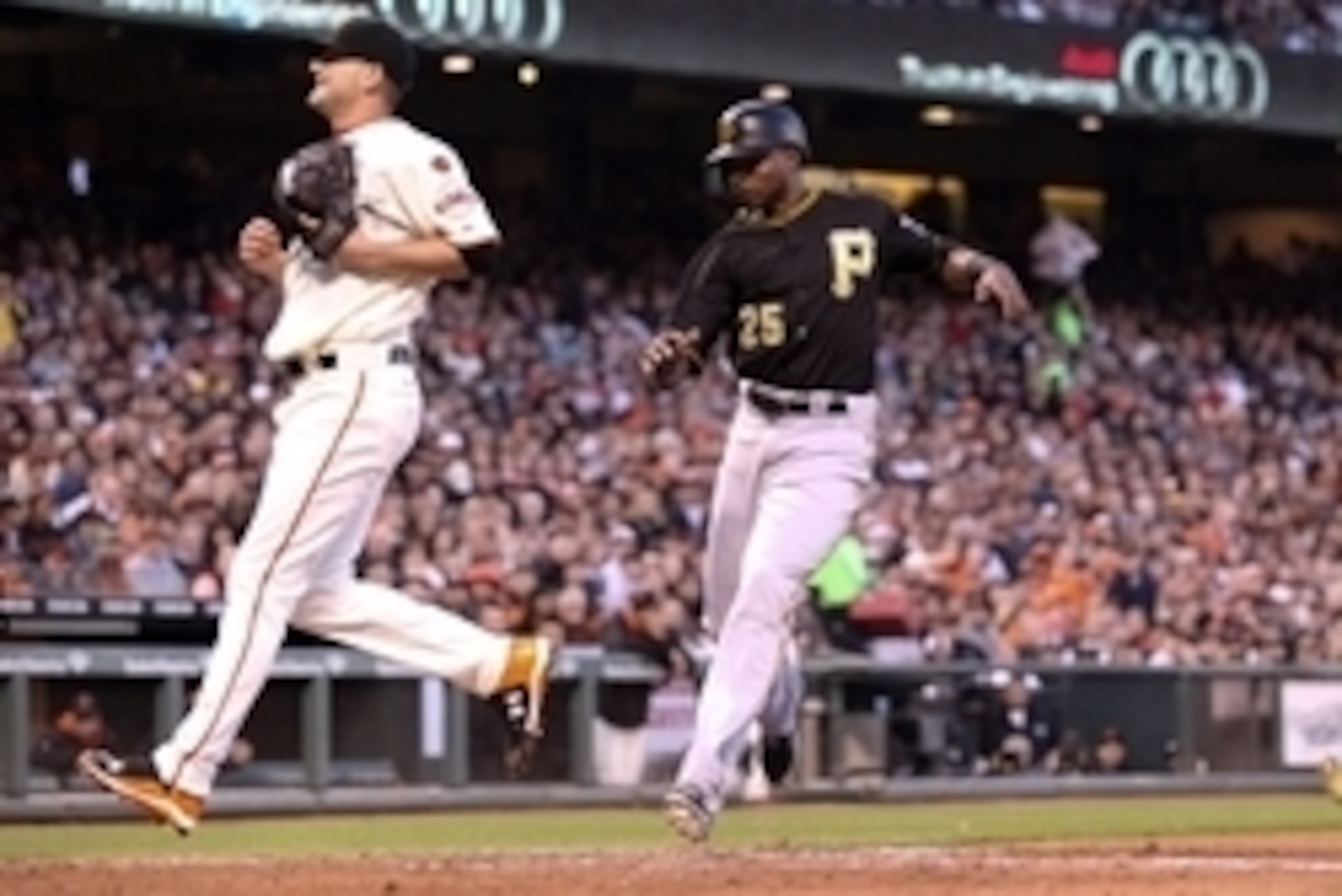 Jun 2, 2015; San Francisco, CA, USA; Pittsburgh Pirates right fielder Gregory Polanco (25) scores a run on a wild pitch by San Francisco Giants starting pitcher Chris Heston (53) during the third inning at AT&T Park. Mandatory Credit: Kelley L Cox-USA TOD