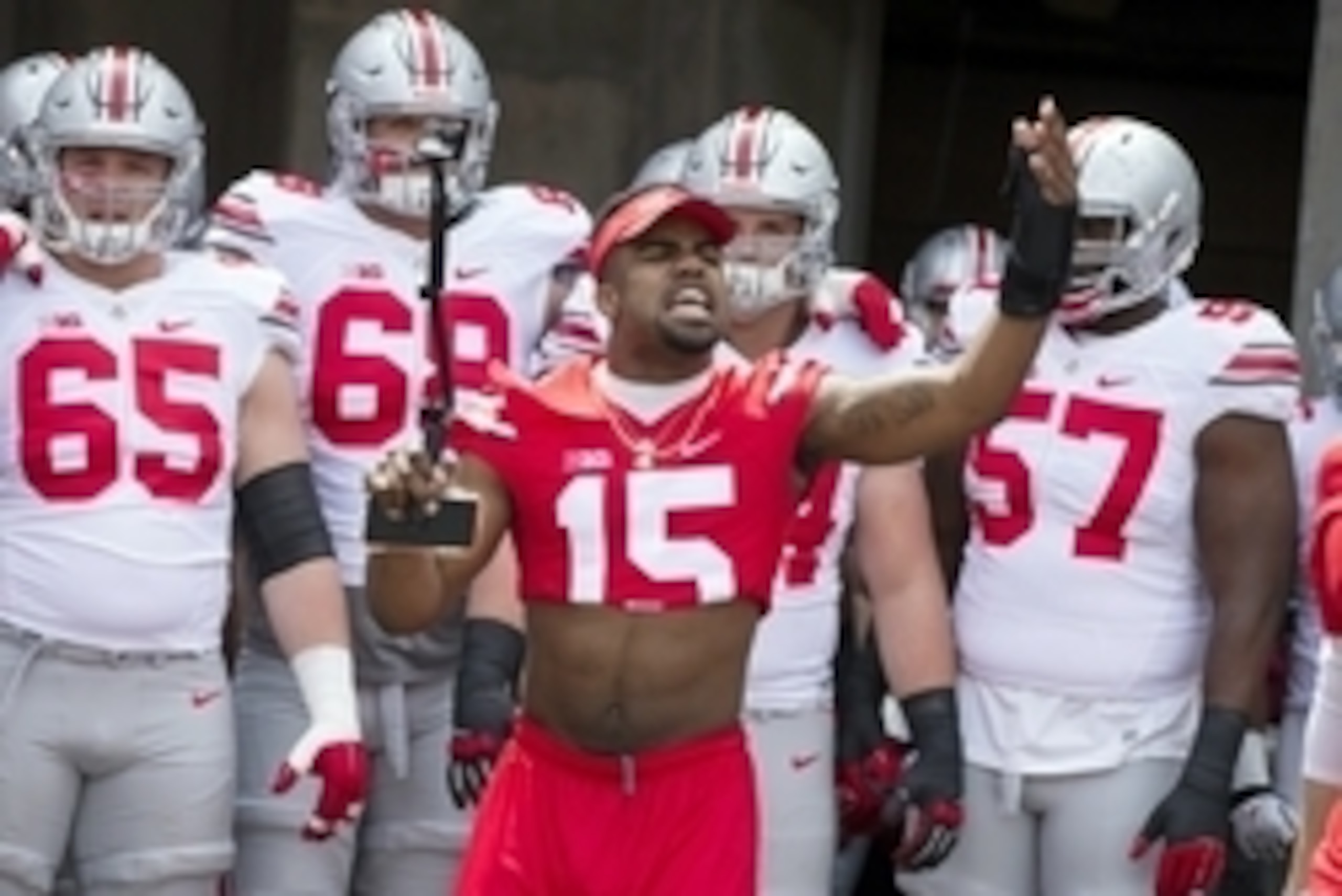 Apr 18, 2015; Columbus, OH, USA; Ohio State Scarlet Team running back Ezekiel Elliott (15) fires up the fans before the team enters the field for the Ohio Spring Game at Ohio Stadium. Mandatory Credit: Greg Bartram-USA TODAY Sports