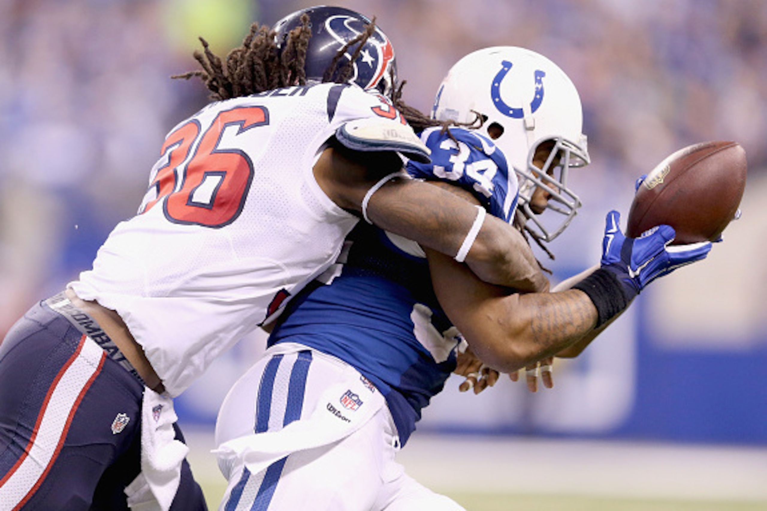 INDIANAPOLIS, IN - DECEMBER 14: Trent Richardson #34 of the Indianapolis Colts catches a pass while defended by D.J Swearinger #36 of the Houston Texans during the game at Lucas Oil Stadium on December 14, 2014 in Indianapolis, Indiana. The Colts won 17- INDIANAPOLIS, IN - DECEMBER 14: Trent Richardson #34 of the Indianapolis Colts catches a pass while defended by D.J Swearinger #36 of the Houston Texans during the game at Lucas Oil Stadium on December 14, 2014 in Indianapolis, Indiana. The Colts won 17-