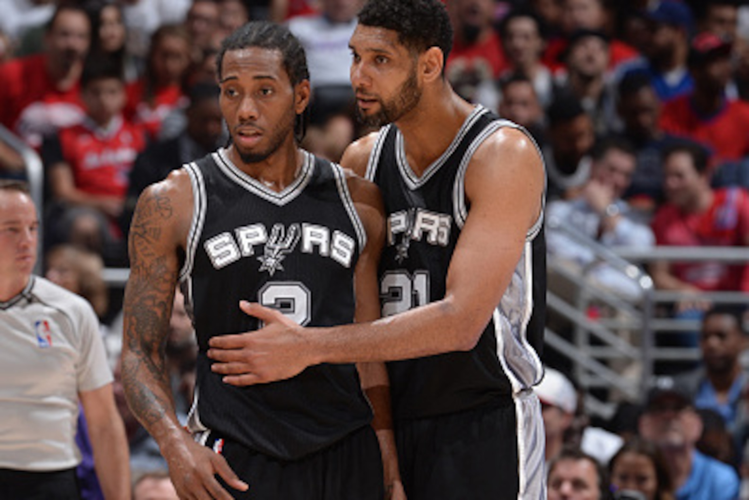 LOS ANGELES, CA - APRIL 28: Kawhi Leonard #2 and Tim Duncan #21 of the San Antonio Spurs celebrates during a game against the Los Angeles Clippers in Game Five of the Western Conference Quarterfinals during the 2015 NBA Playoffs on April 28, 2015 at Stapl