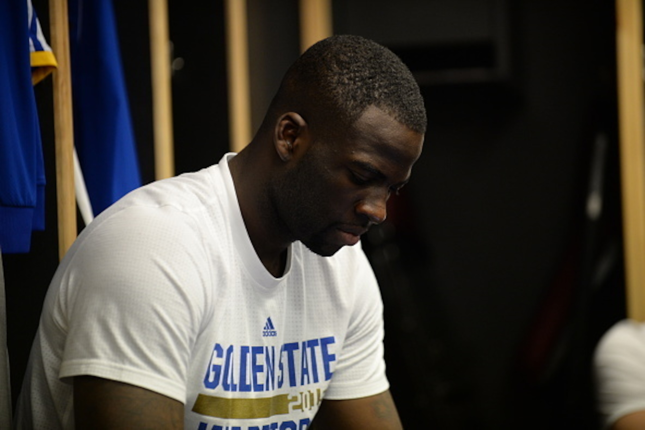 CLEVELAND, OH - JUNE 9: Draymond Green #23 of the Golden State Warriors gets ready in the locker room before a game against the Cleveland Cavaliers in Game Three of the 2015 NBA Finals on June 9, 2015 at The Quicken Loans Arena in Cleveland, OH. NOTE TO U