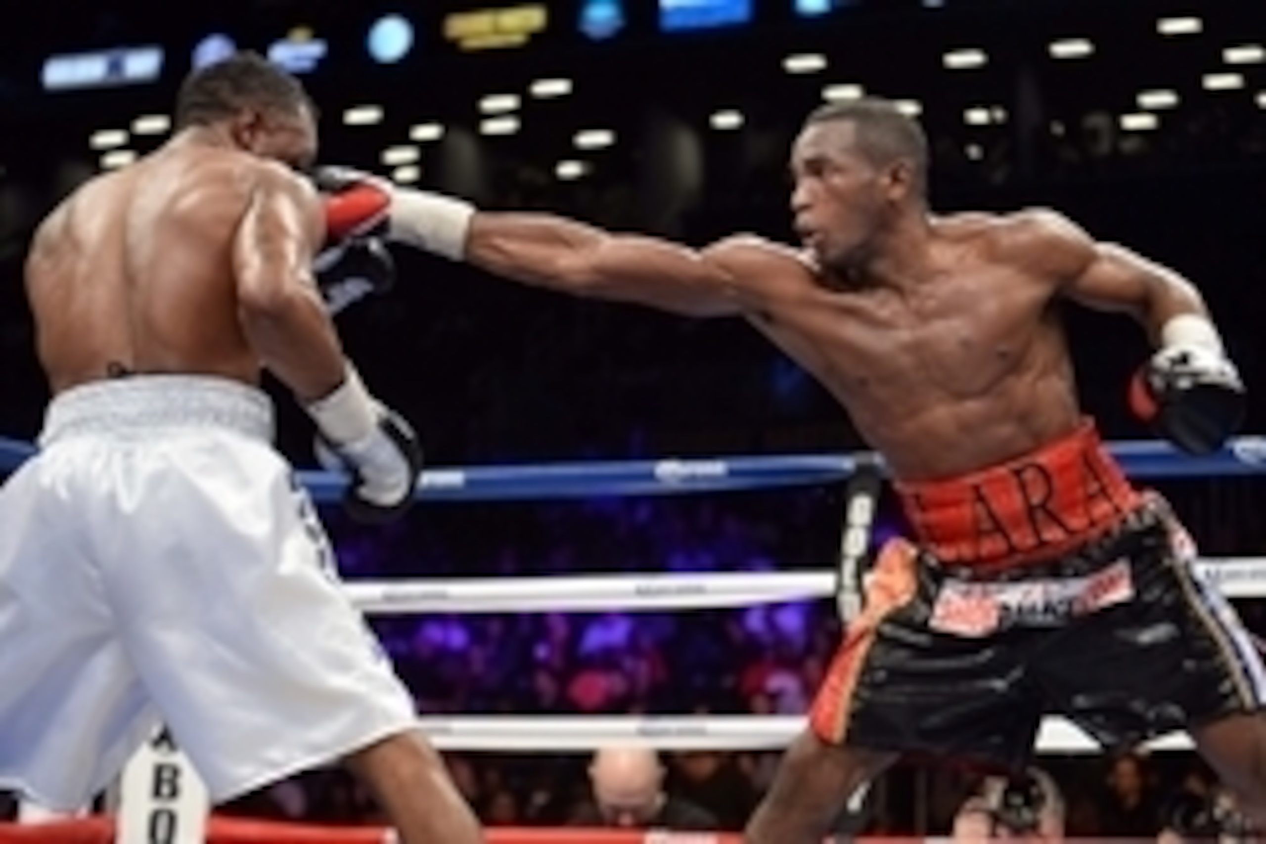 Dec 7, 2013; Brooklyn, NY, USA; Erislandy Lara (black trunks) and Austin Trout (white trunks) box during their WBA Interim Super Welterweight title bout at Barclays Center. Lara won via unanimous decision. Mandatory Credit: Joe Camporeale-USA TODAY Sports